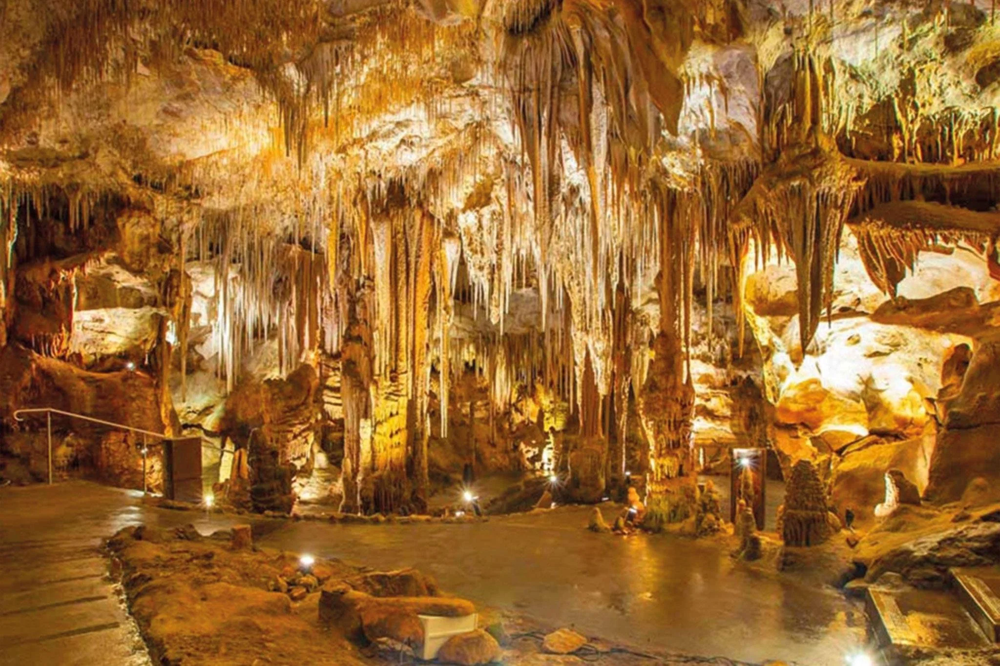 Stalactites lit in the limestone caverns of the Grotte di Castellana, Puglia