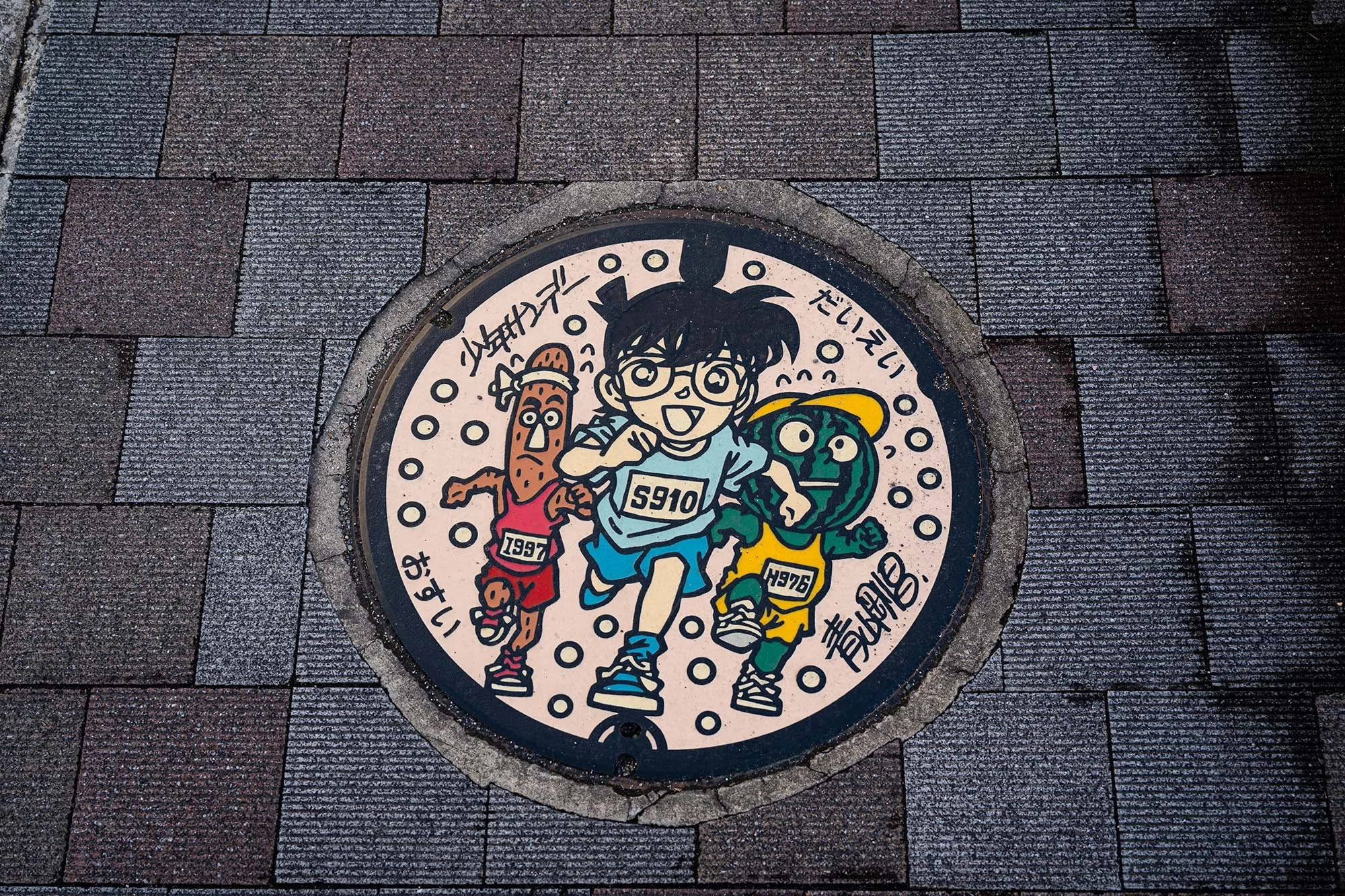 manhole cover with detective conan manga art in hokuei tottori