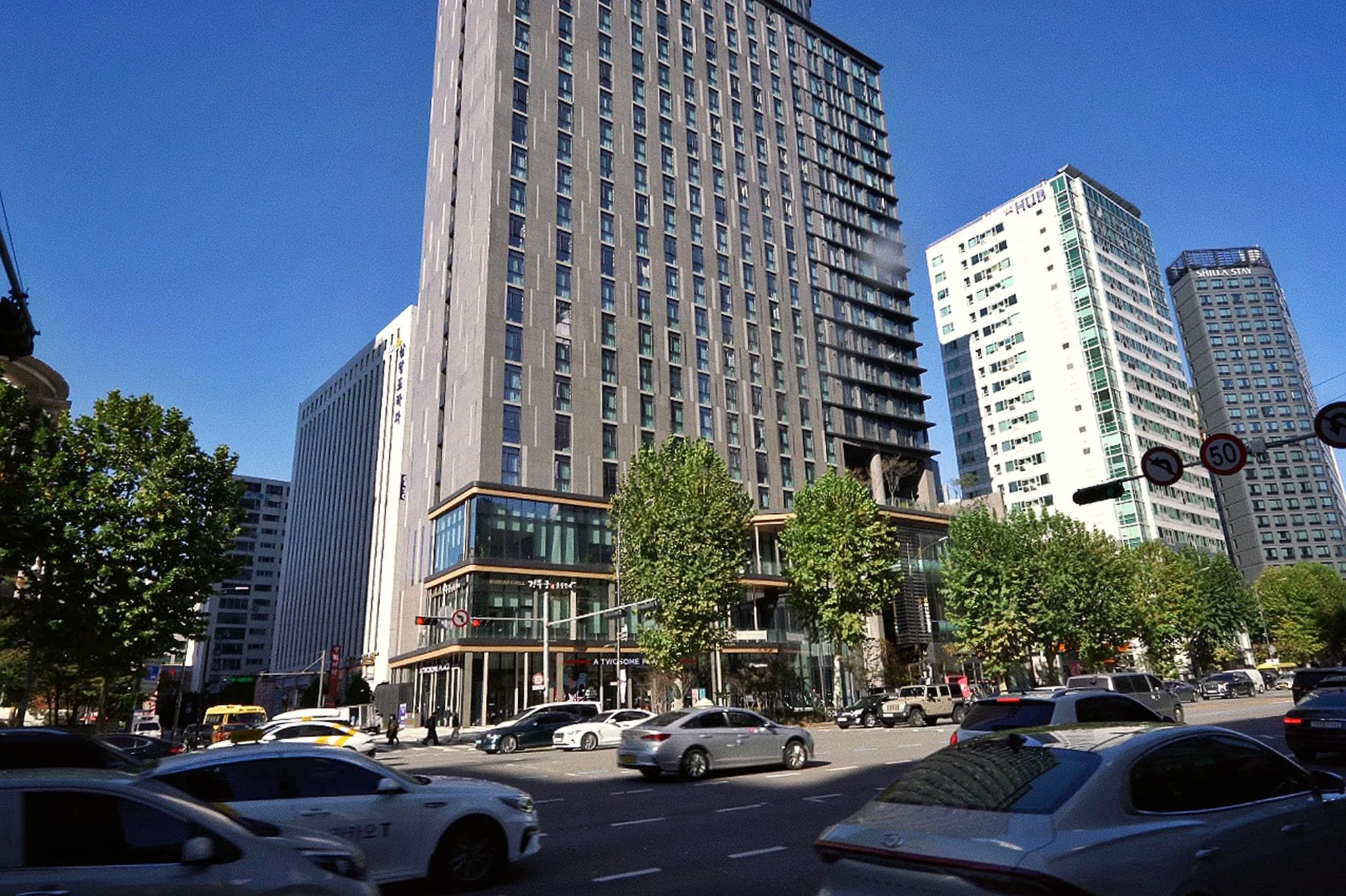 hotel building and street traffic on a sunny day in mapo seoul
