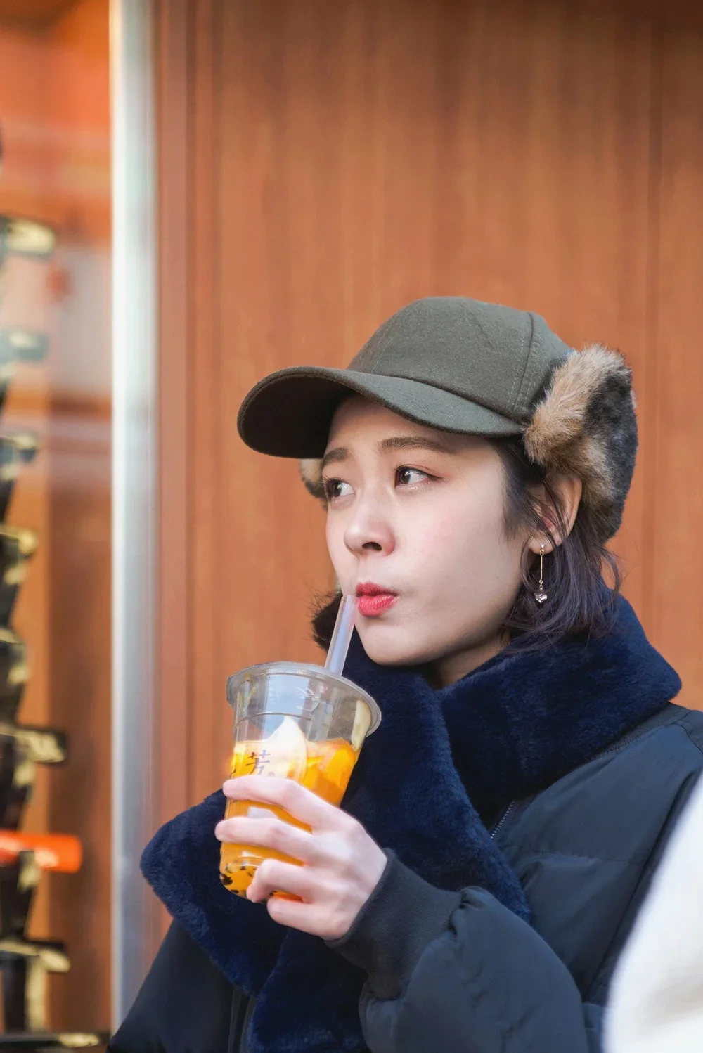 young woman drinking fruit tea in asakusa tokyo japan