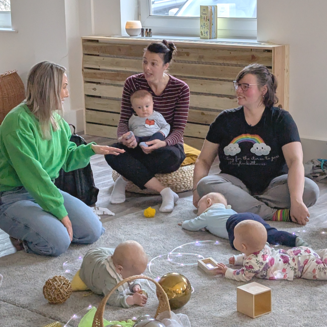 Three new mums chat and laugh about postpartum while their babies play at 'The Nest'
