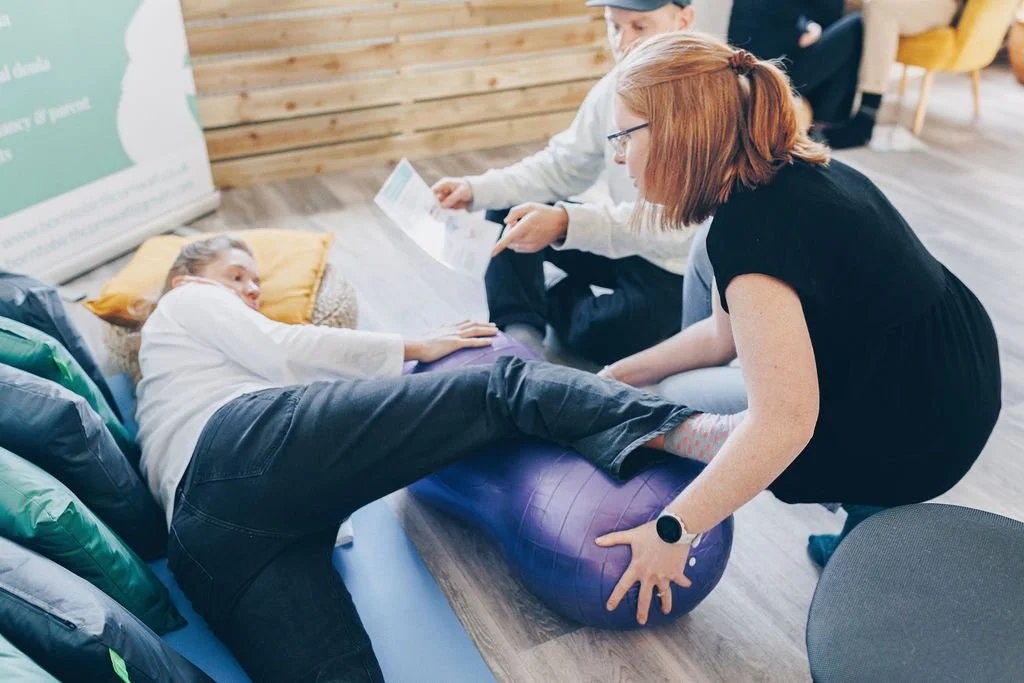 Gemma Kitto from Born to Birth Cornwall supports a pregnant woamn and her partner to learn effective positions for birth during an antenatal class in Cornwall