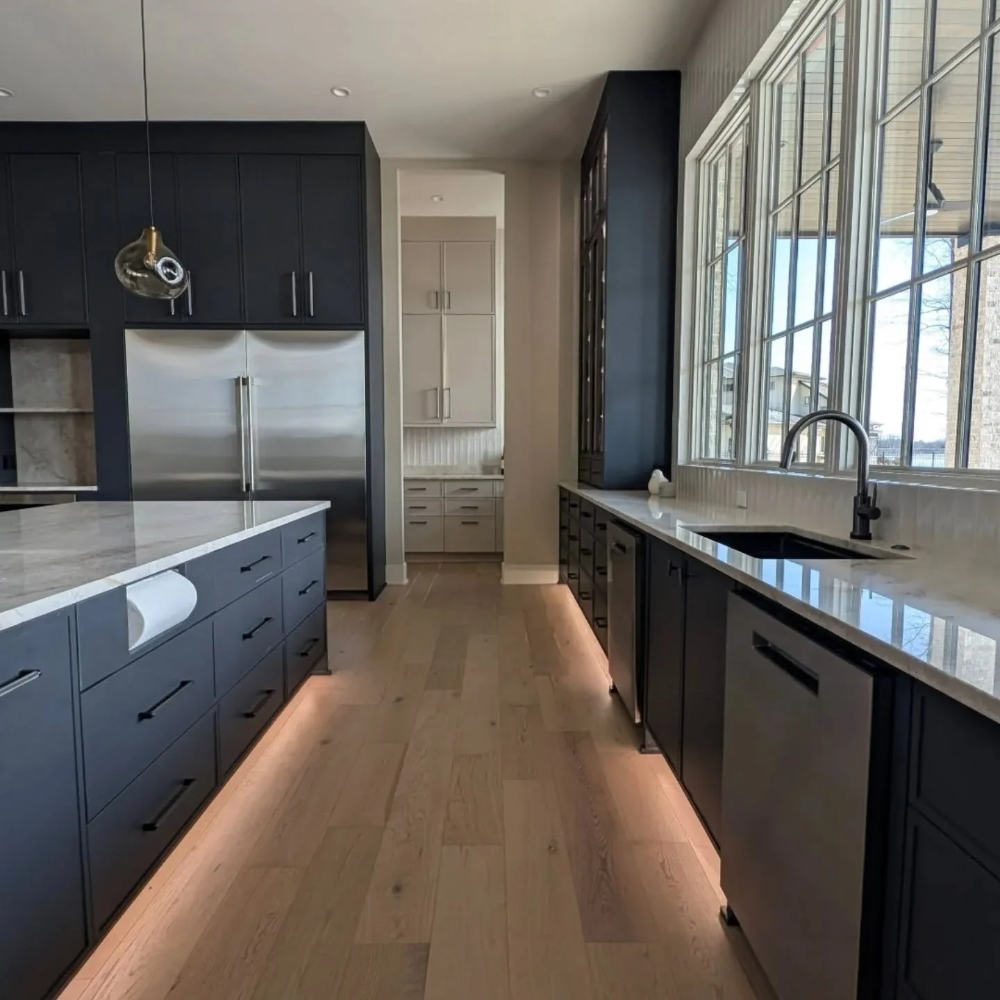 Two islands weren't a luxury&mdash;they were the solution. One for cooking and prep. One for gathering, homework, and coffee that doesn't get knocked over mid-dinner rush.

When you're a busy professional who actually wants to use your kitchen (not j
