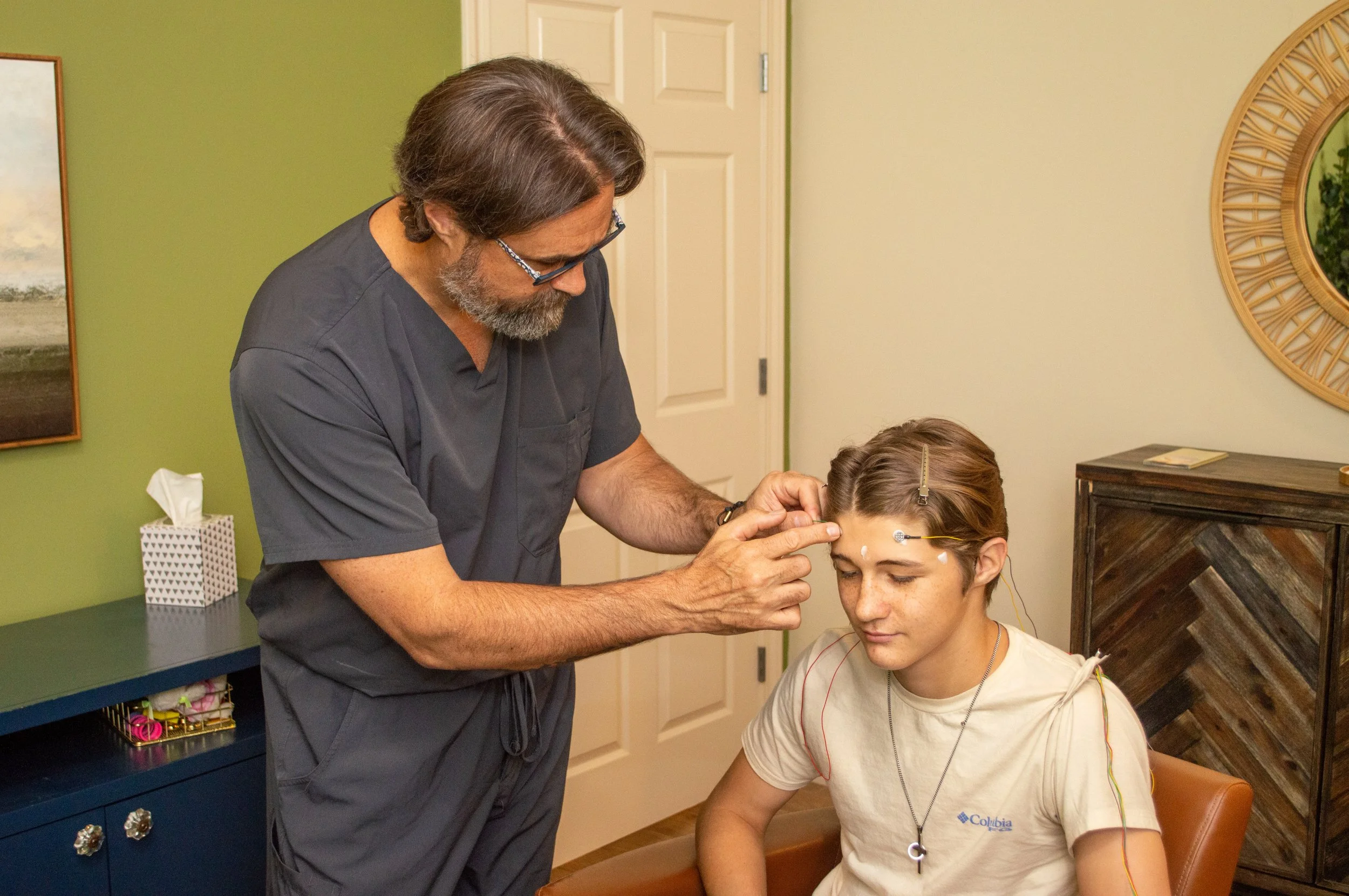 MCN expert applying sensors to child's head