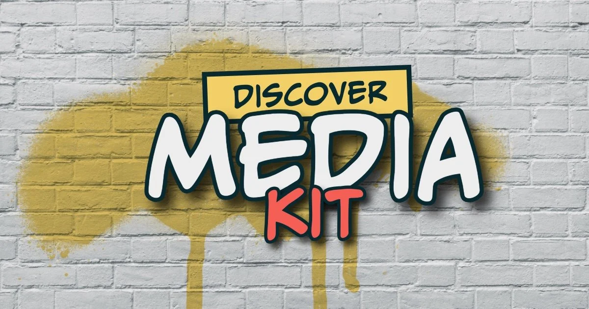 Graffiti-style text on a white brick wall reading 'Discover Media Kit' with yellow spray paint background.