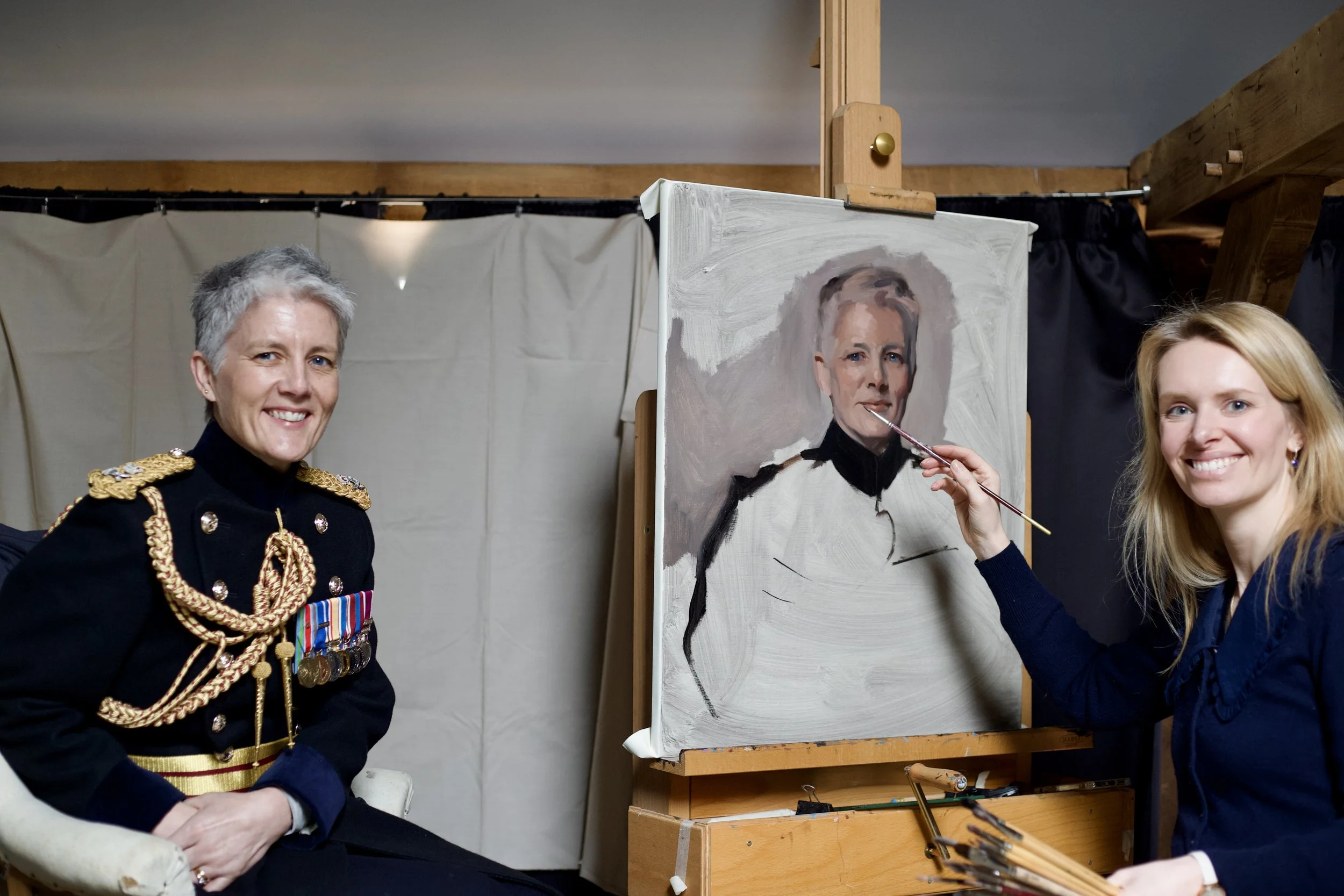 A woman painting a portrait of an elderly man playing a grand piano in a cozy living room, with a dog lying on the hardwood floor.