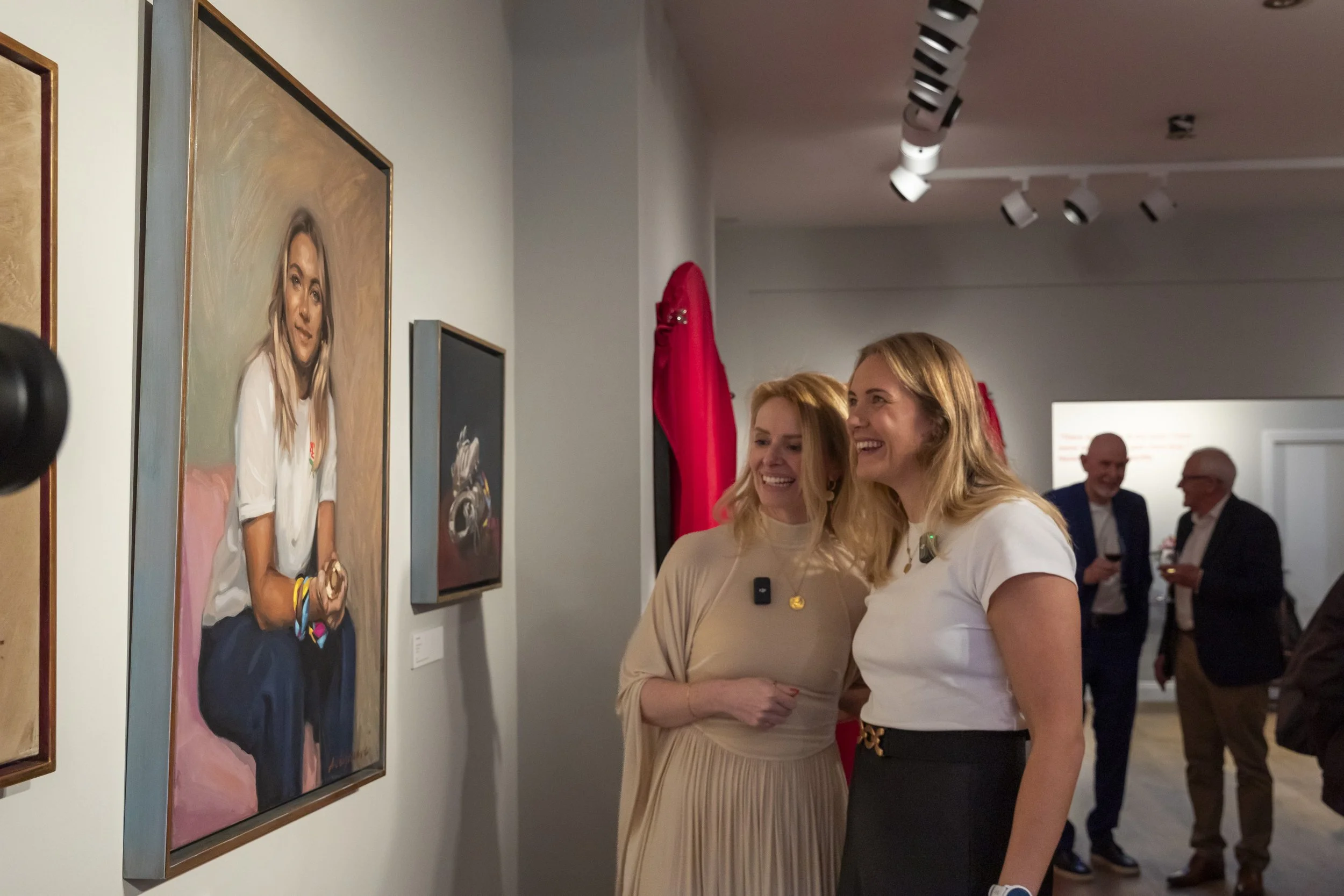 Zeo Stratford being unveiled her painting by Caroline de Peyrecave