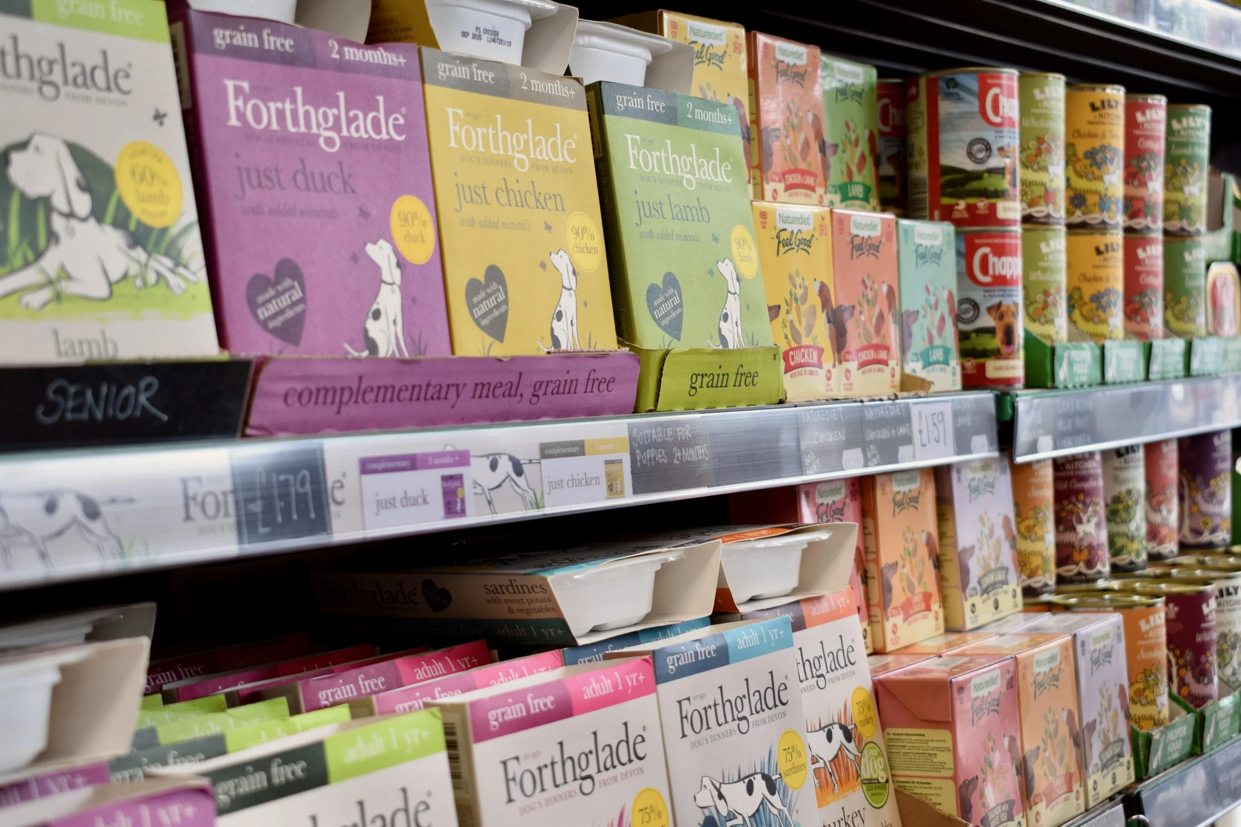 dog food packets on a shop shelf