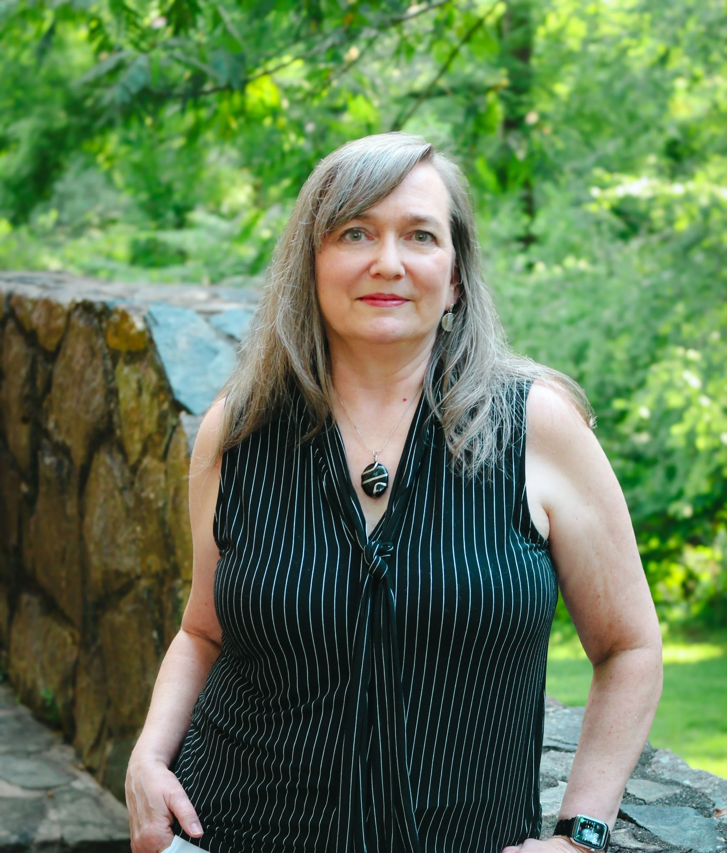 Beth Hovis, iridology instructor and holistic wellness educator, photographed outdoors, representing natural health education and practitioner training.