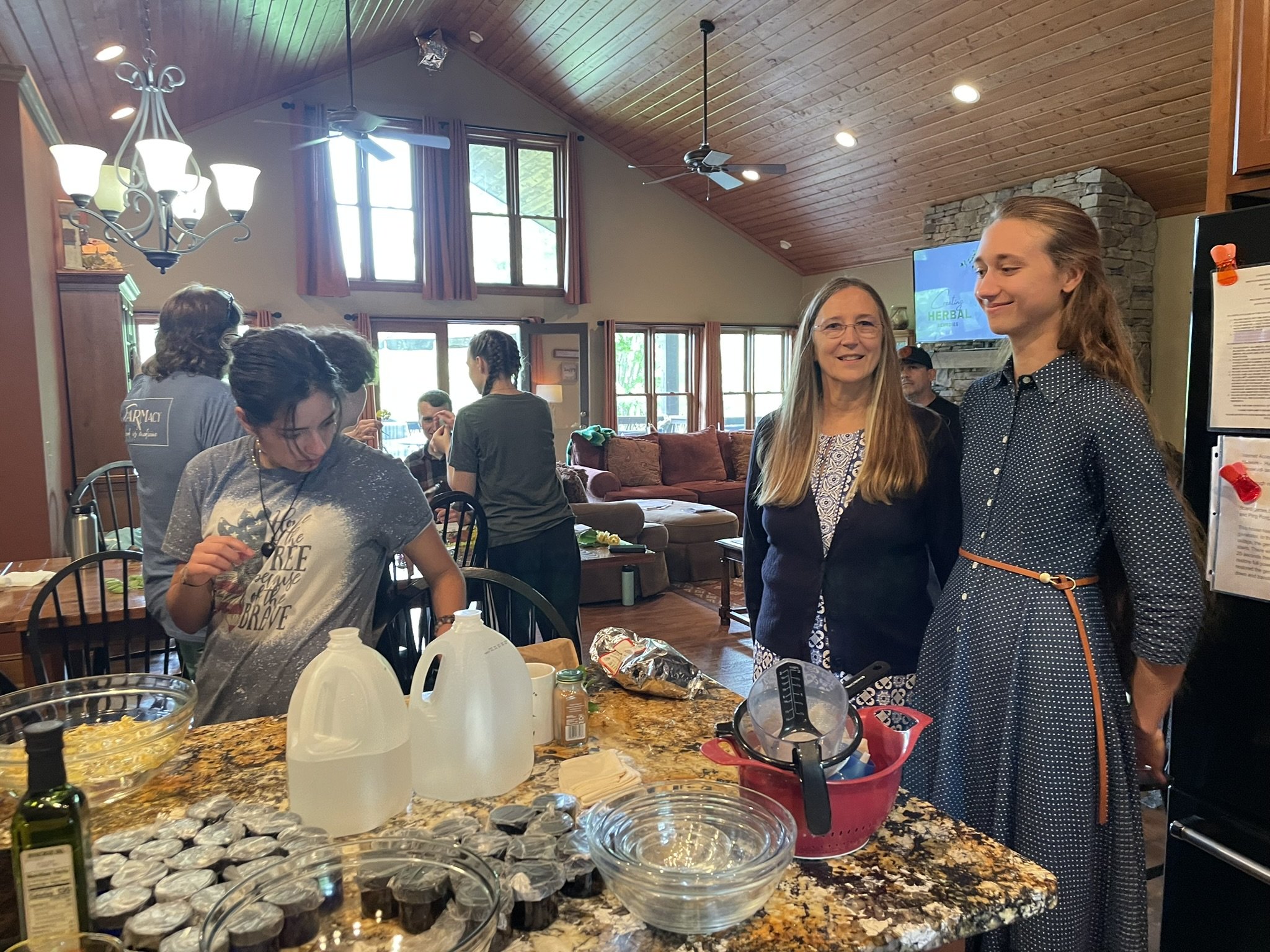 Group of students learning and preparing herbal remedies in a hands-on training environment during the Brilliant Health Weekend Away Herbal Bootcamp.