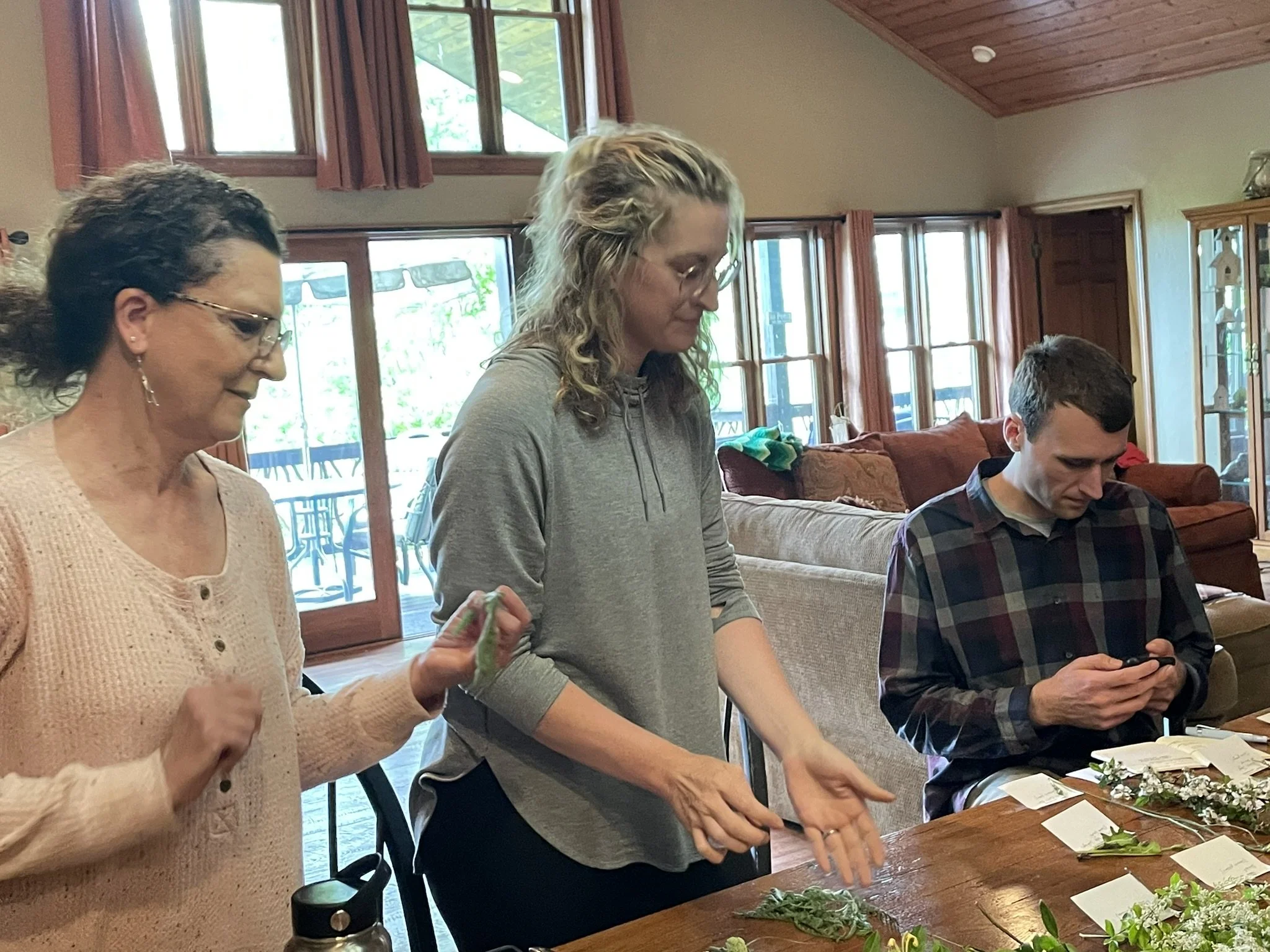 Participants labeling herbs during the Herbal Bootcamp at the Brilliant Health Weekend Away.