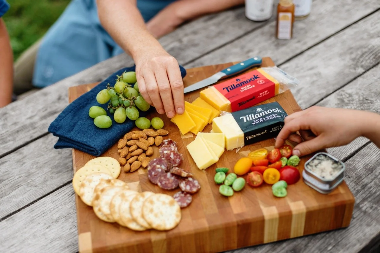 02_Digital_AFF21_RiseRoot_Cheeseboard_wHands_R1 Large.jpeg