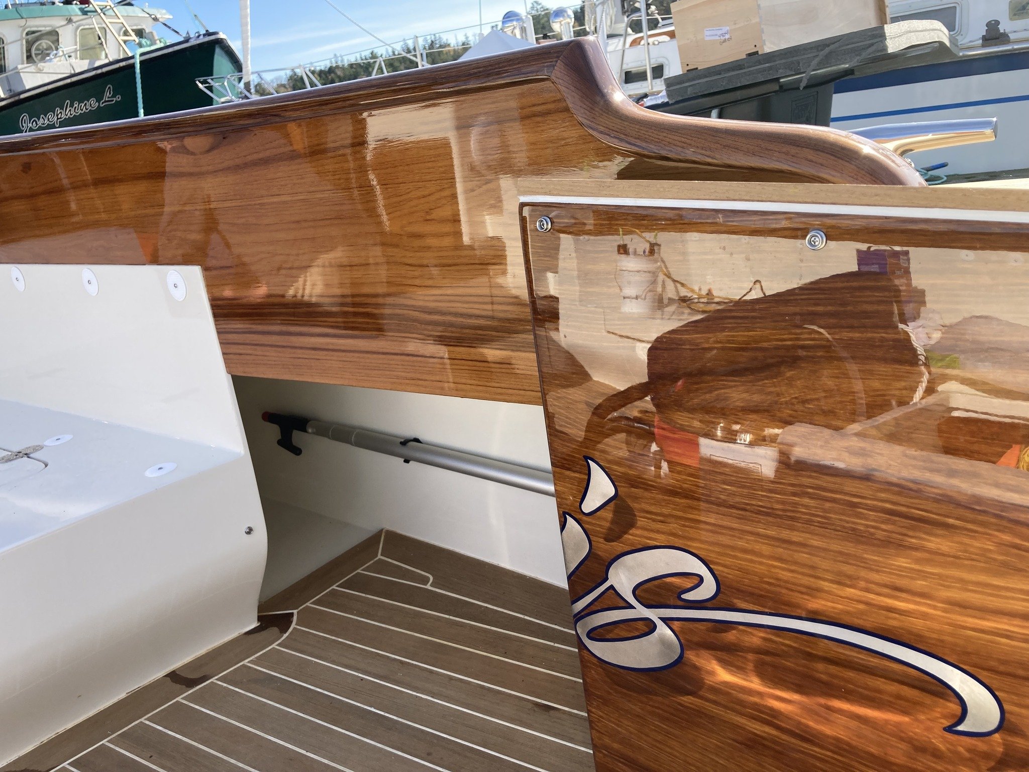 Always happy to see a good color match when the transom door (faux) opens in onto the real teak combing.