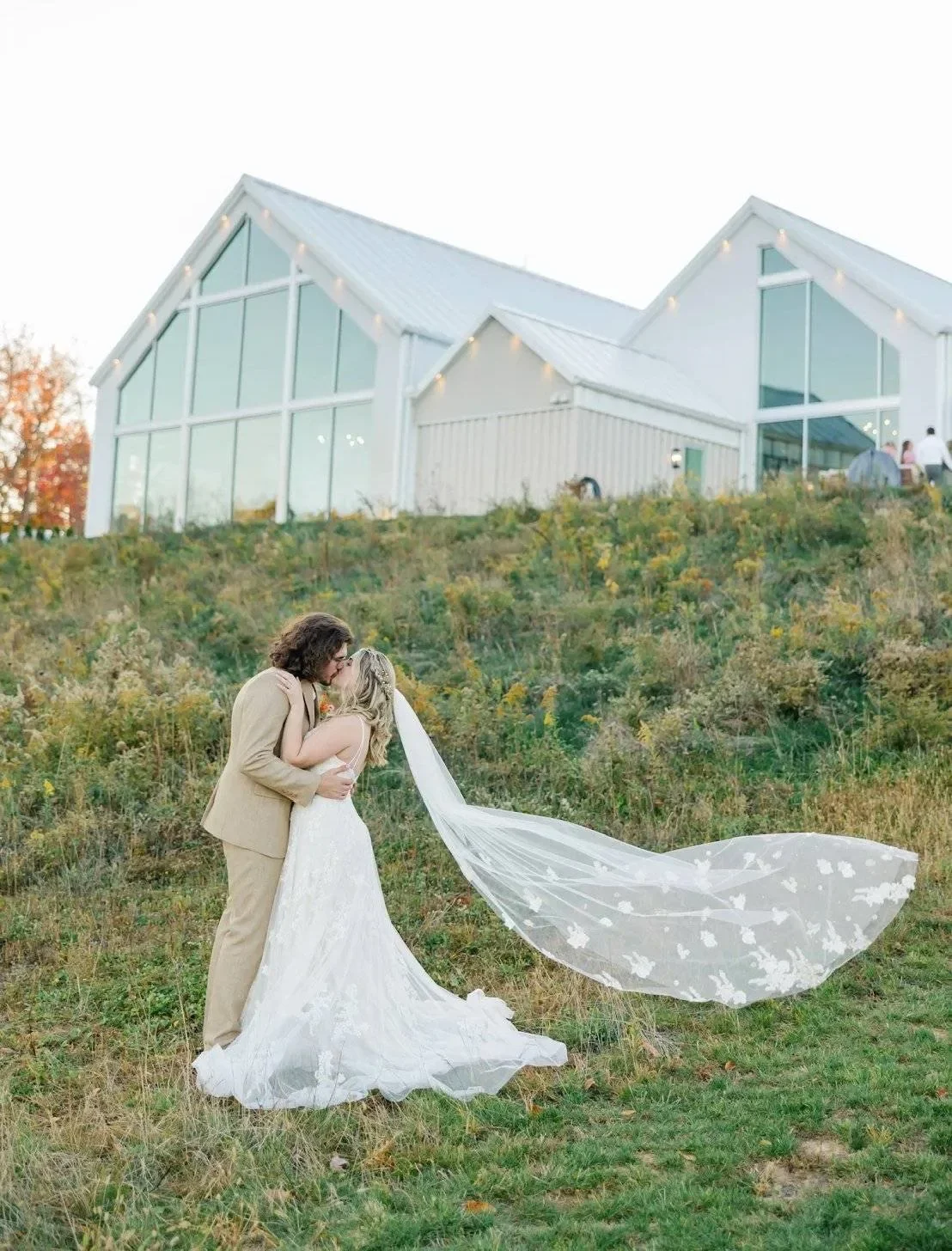 Bride and groom portrait in wildflower field