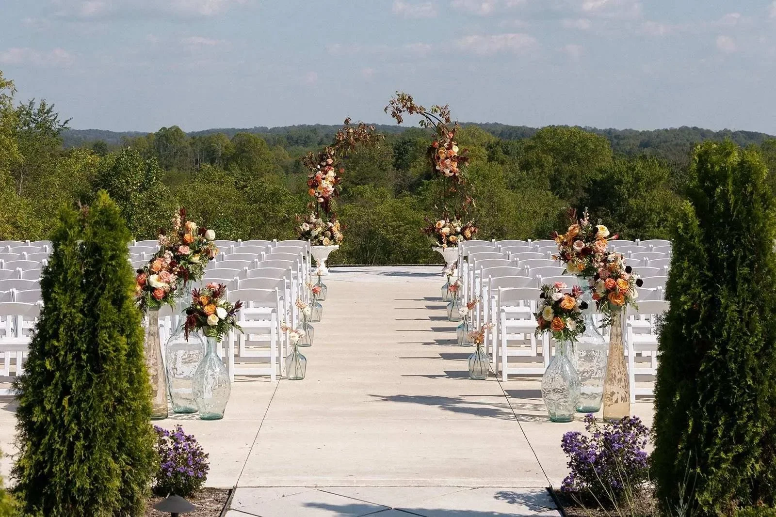Wedding ceremony inside venue with panoramic windows