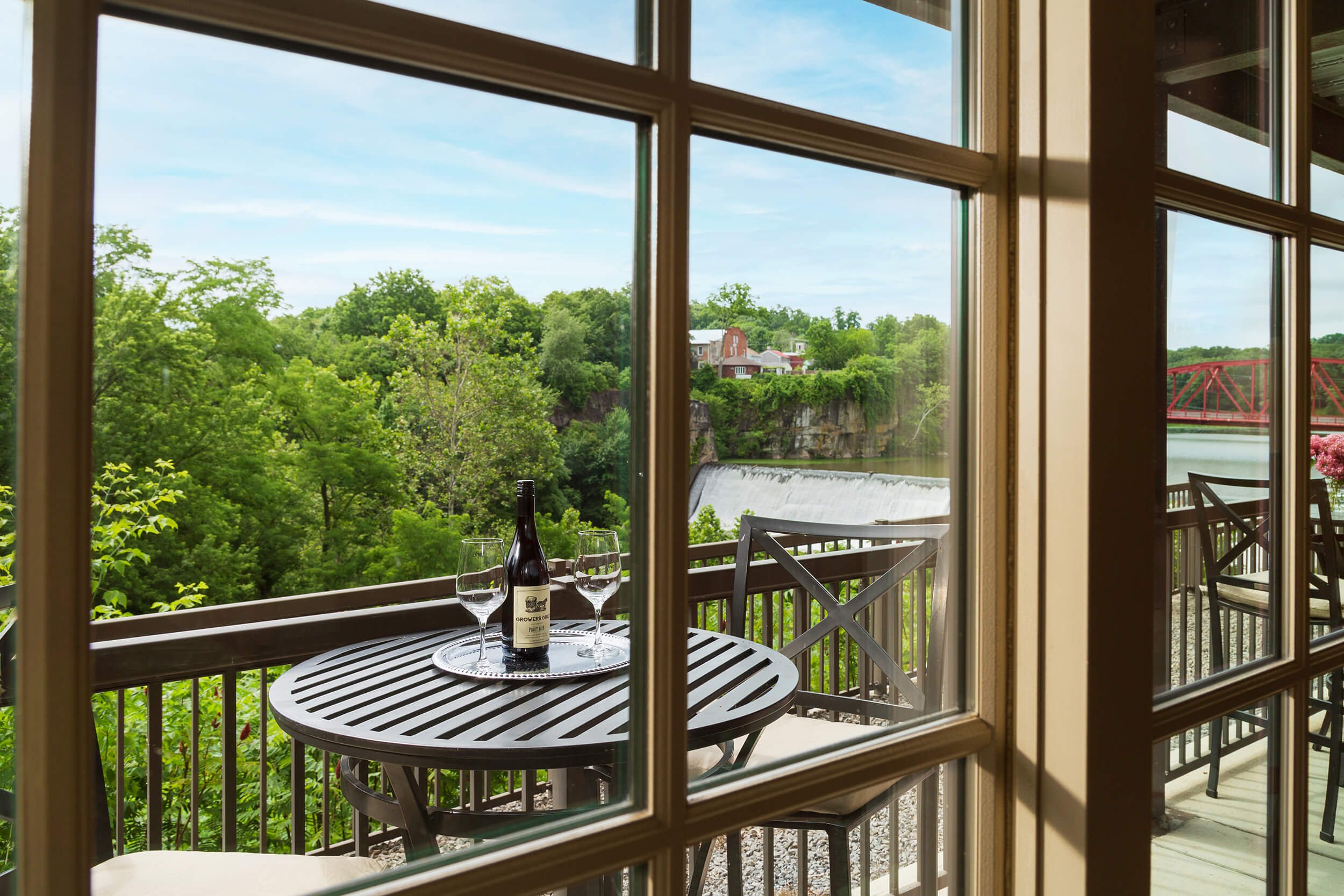 The balcony overlooking the Esopus Waterfall in the Esopus Suite at Diamond Mills hotel in Saugerties, NY