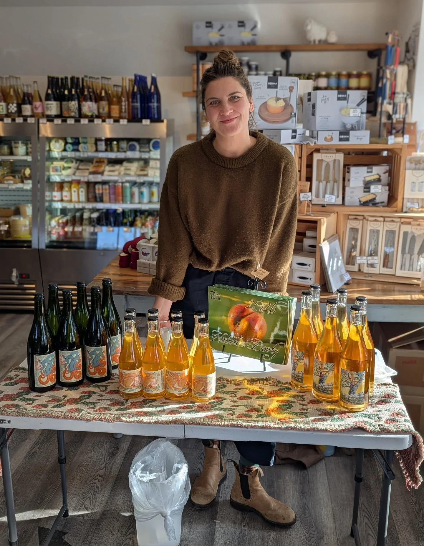 Anna from @leftbankciders is here sampling their delicious, local ciders. Come on by for a taste and pick up a bottle or two for your holiday gatherings. 10% all Left Bank ciders today! 🍎 🥂