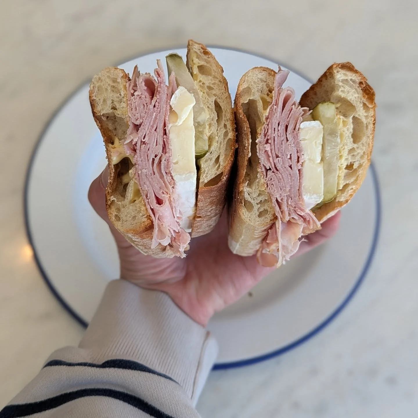 April Sandwich Special: The Ham &amp; Brie 🥖

A spin off on the classic French Jambon Beurre (aka ham + butter on baguette). Featuring @northwindfarms Smoked Ham, French triple cr&egrave;me Brie, sliced dill pickles and dijonnaise on @tribecaoveninc