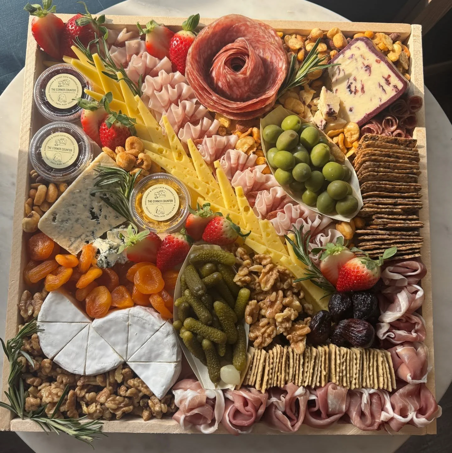 It's Memorial Day weekend! Our kitchen team and cheesemonger Erin are busy building beautiful boards &amp; platters!

We are fully booked for catering Friday &amp; Saturday. We have limited availability Sunday &amp; Monday. If you need an order, plea