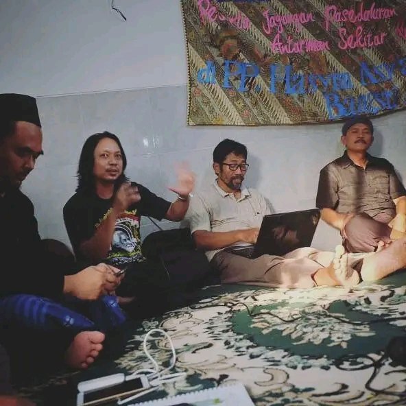   Danang converses with a Muslim leader, a Christian leader and a local religious leader. Interfaith dialogue, like this, is becoming more common, Danang said.  Photo contributed by Danang Kristiawan.   