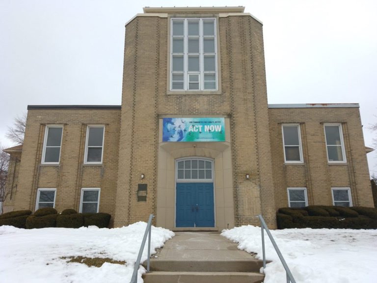  The banner hanging above the door at First Mennonite Church in Kitchener reads: “Join communities for climate justice: Act now.” The website for Faith Climate Justice, the group that created the banner, says: “It is our belief that the more of thes