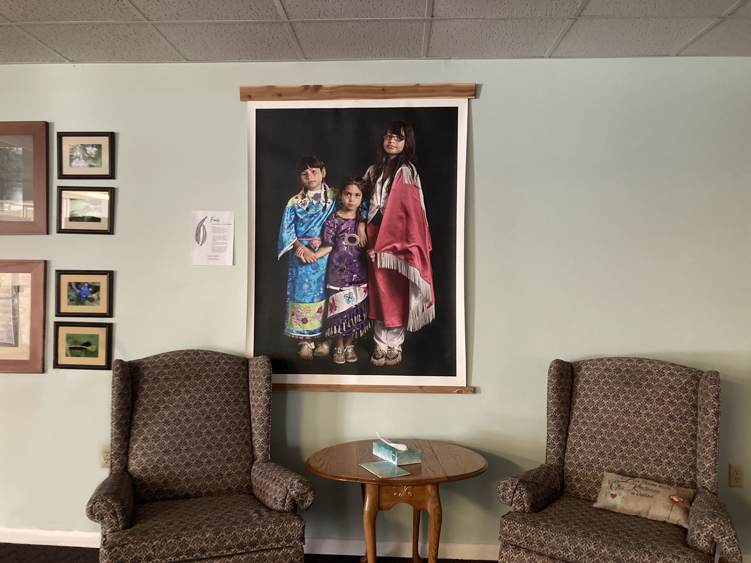   A photograph by Potawatomi artist Sharon Hoogstraten hangs in the foyer at Waterford Mennonite Church. The portrait features three Potawatomi dancers, Selphie, age 8, Lilly, age 6, and Mimike, age 10. Sharon, from Kalamazoo, Michigan, said in a sta