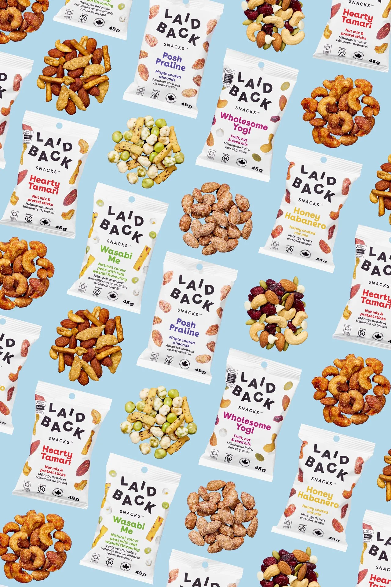 bold, colorful, vibrant product photography flat lay image of individual servings of trail mix and piles of nuts and seeds on a blue backdrop