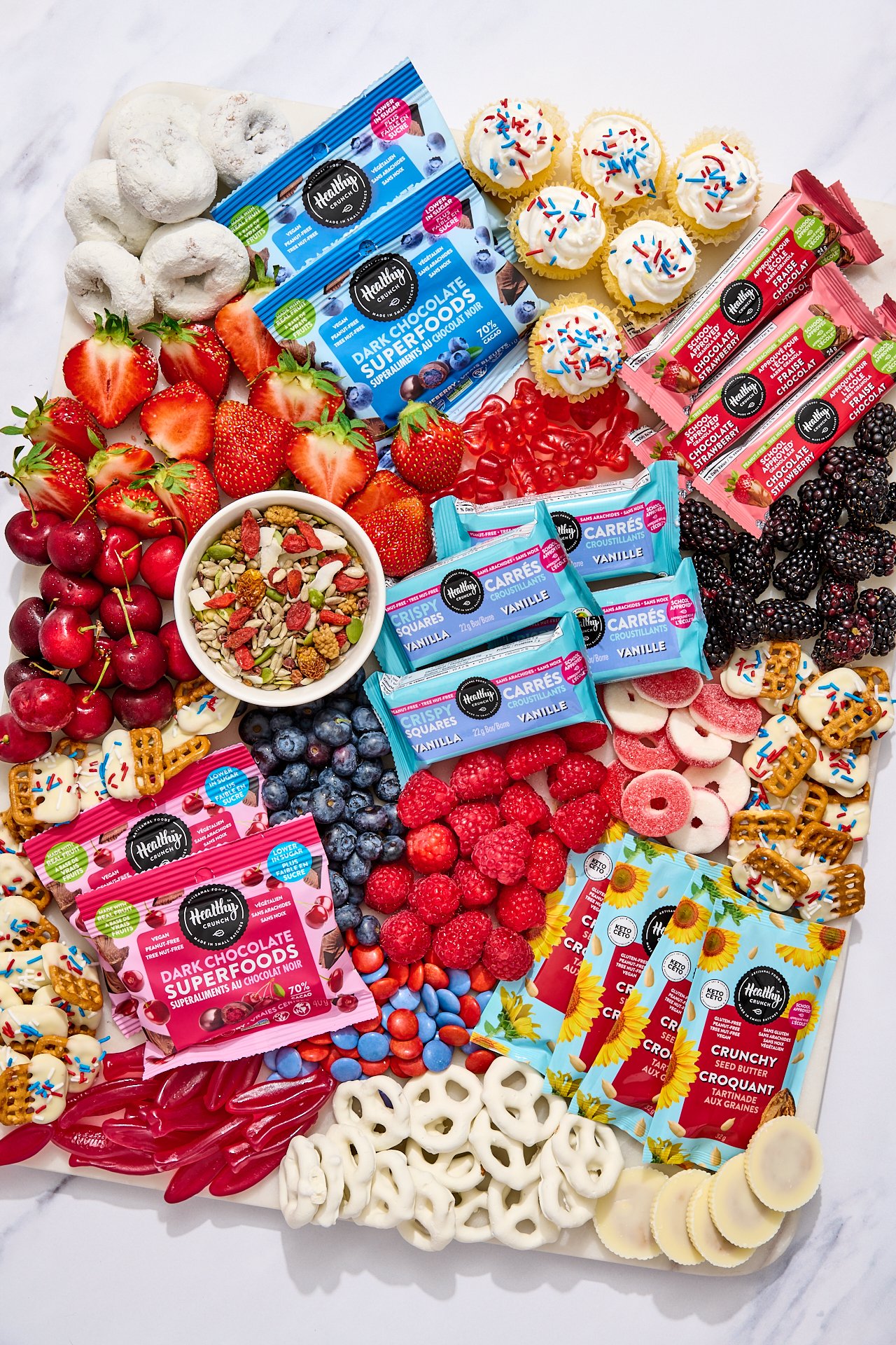an overhead shot of a fourth of july dessert board for a cpg snack brand\