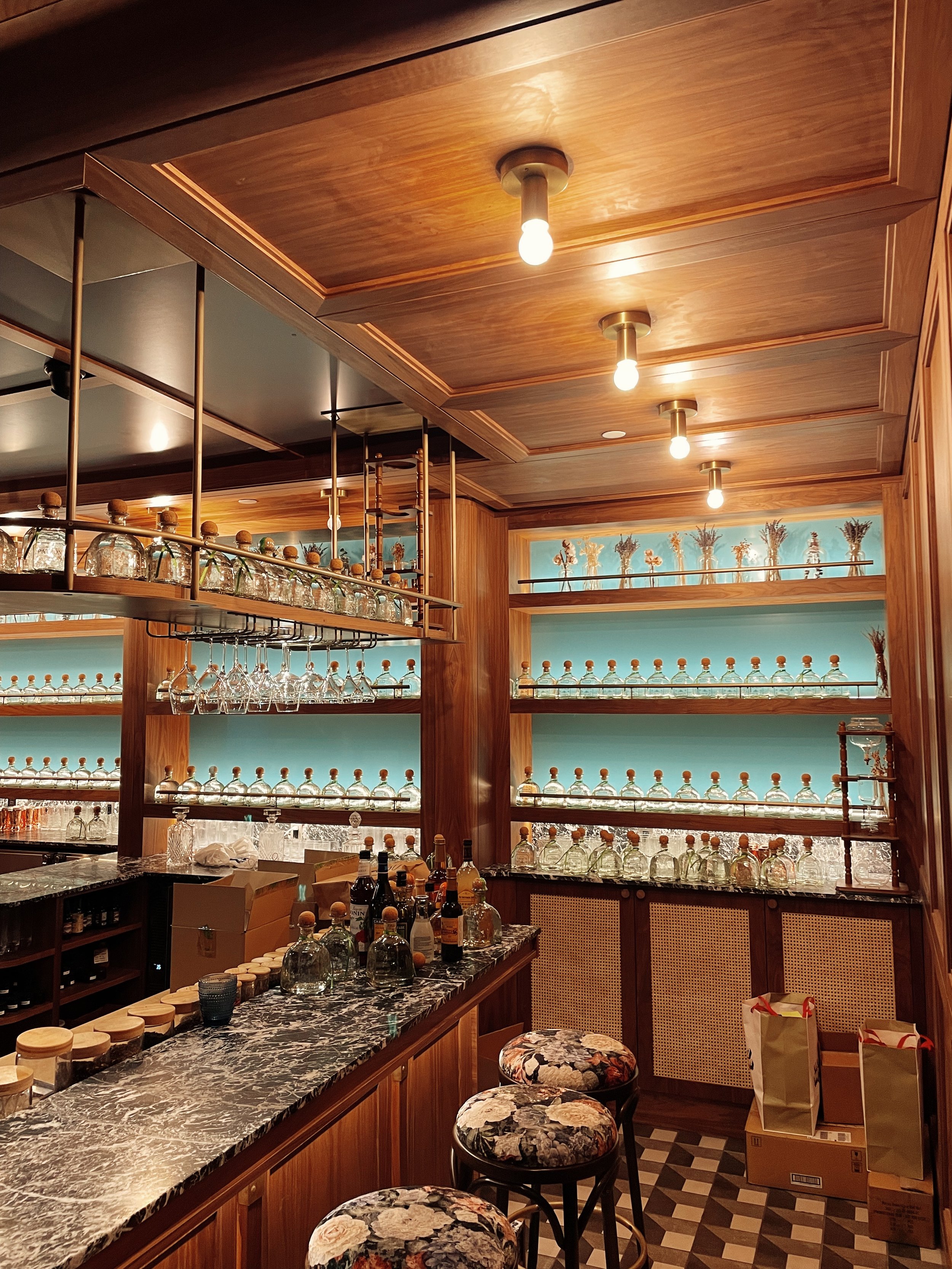 a bar styled with patron tequila bottles for a patron photoshoot