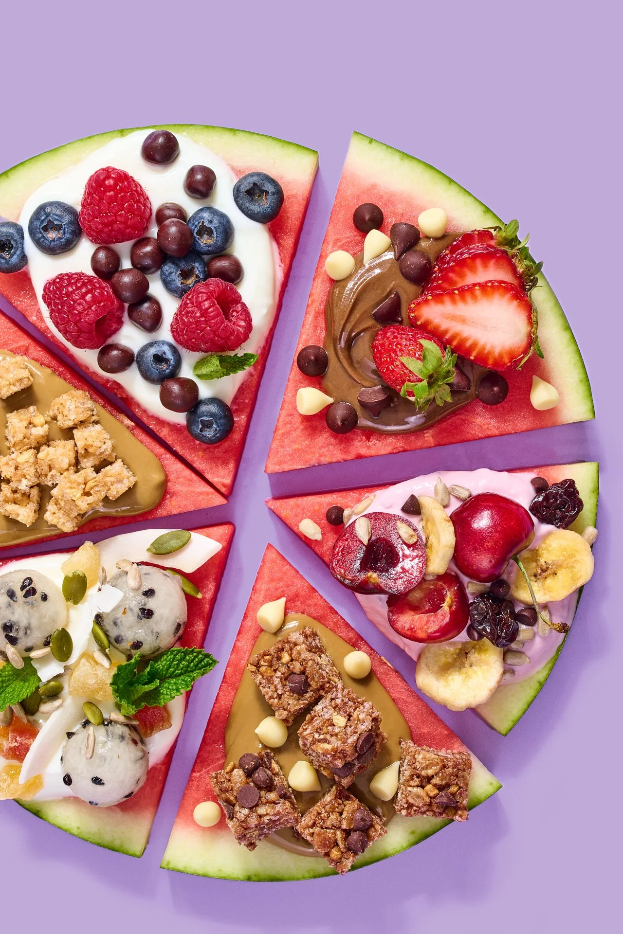 watermelon pizza styles with fresh fruit and yogurt on a purple background