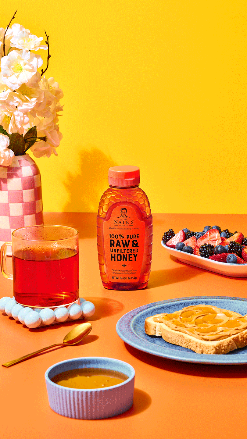 honey bottle with breakfast and dinner scene on a bright colored background