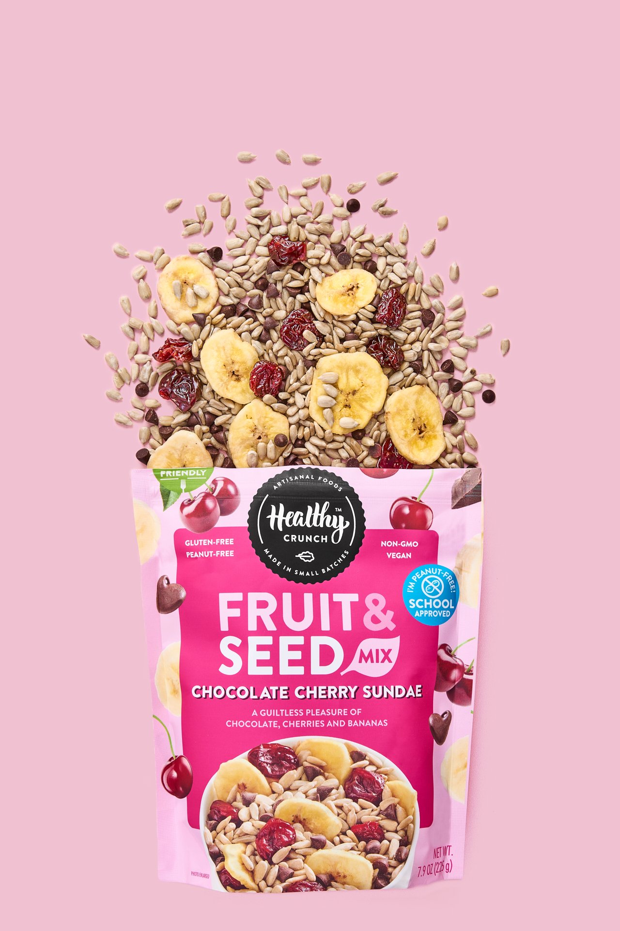 an overhead product shot of dried bananas and seeds coming out of cpg snack brand bag