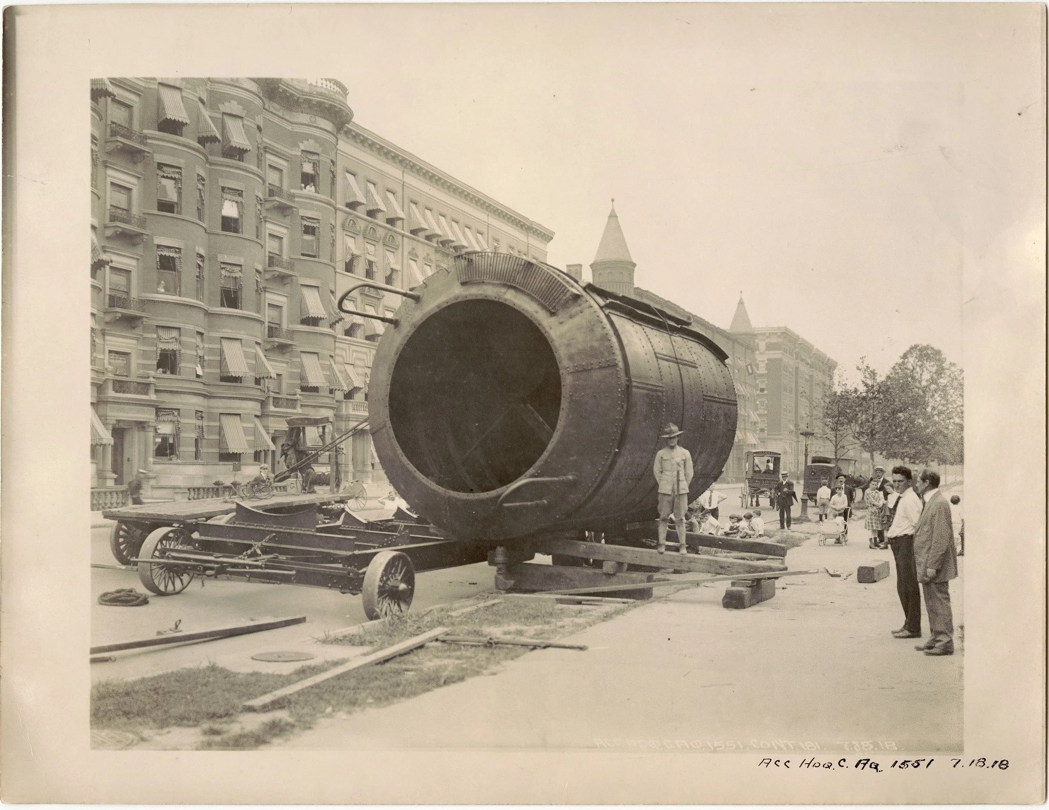 A pump float and the truck designed to transport it through Manhattan on July 18, 1918. Shown here about to be loaded at Morningside Avenue and West 121st Street, it was part of the drainage equipment for City Water Tunnel No. 1, which still brings w