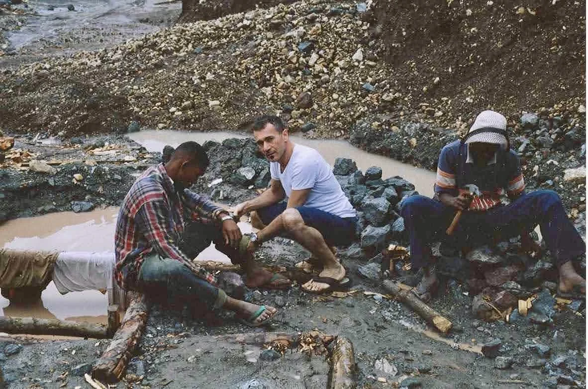 Local miners working with raw Larimar stones in the Dominican Republic.