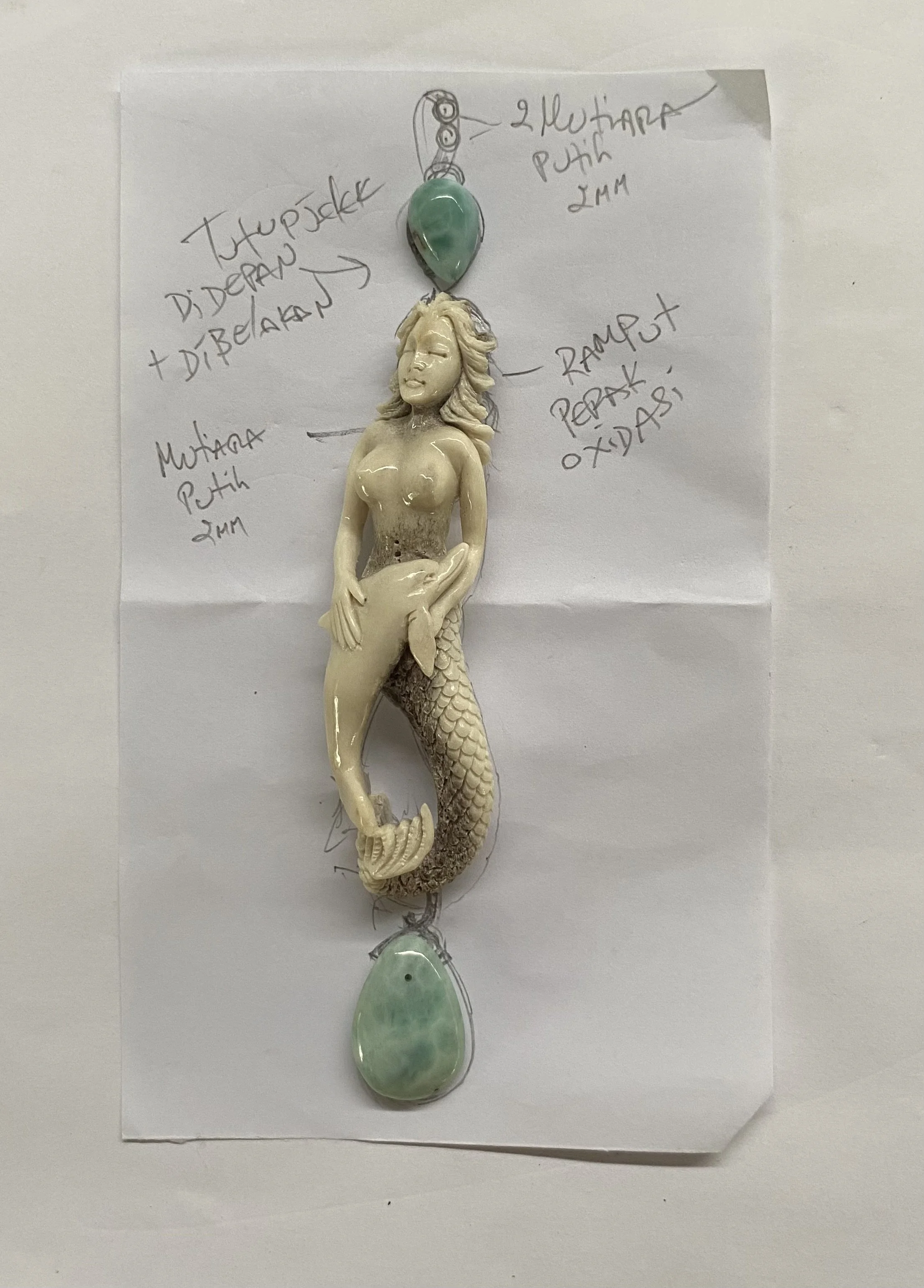 Original Larimar jewelry design by Taso Haidemenakis, featuring a sculptural mermaid figure with gemstone details.