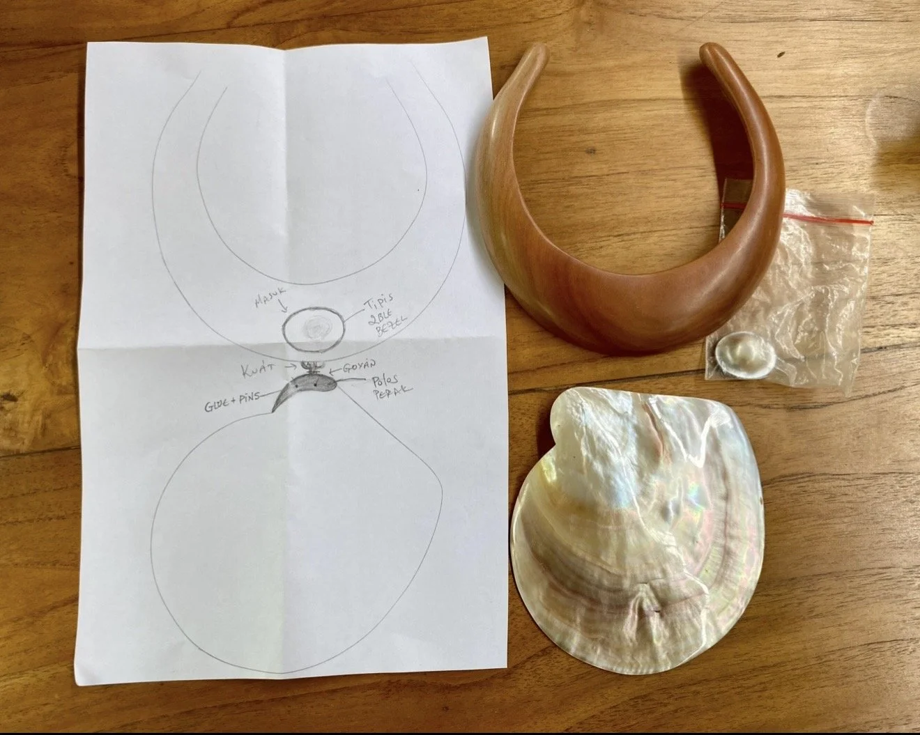 TASO jewelry design process with hand-drawn sketches, carved shells and natural materials.