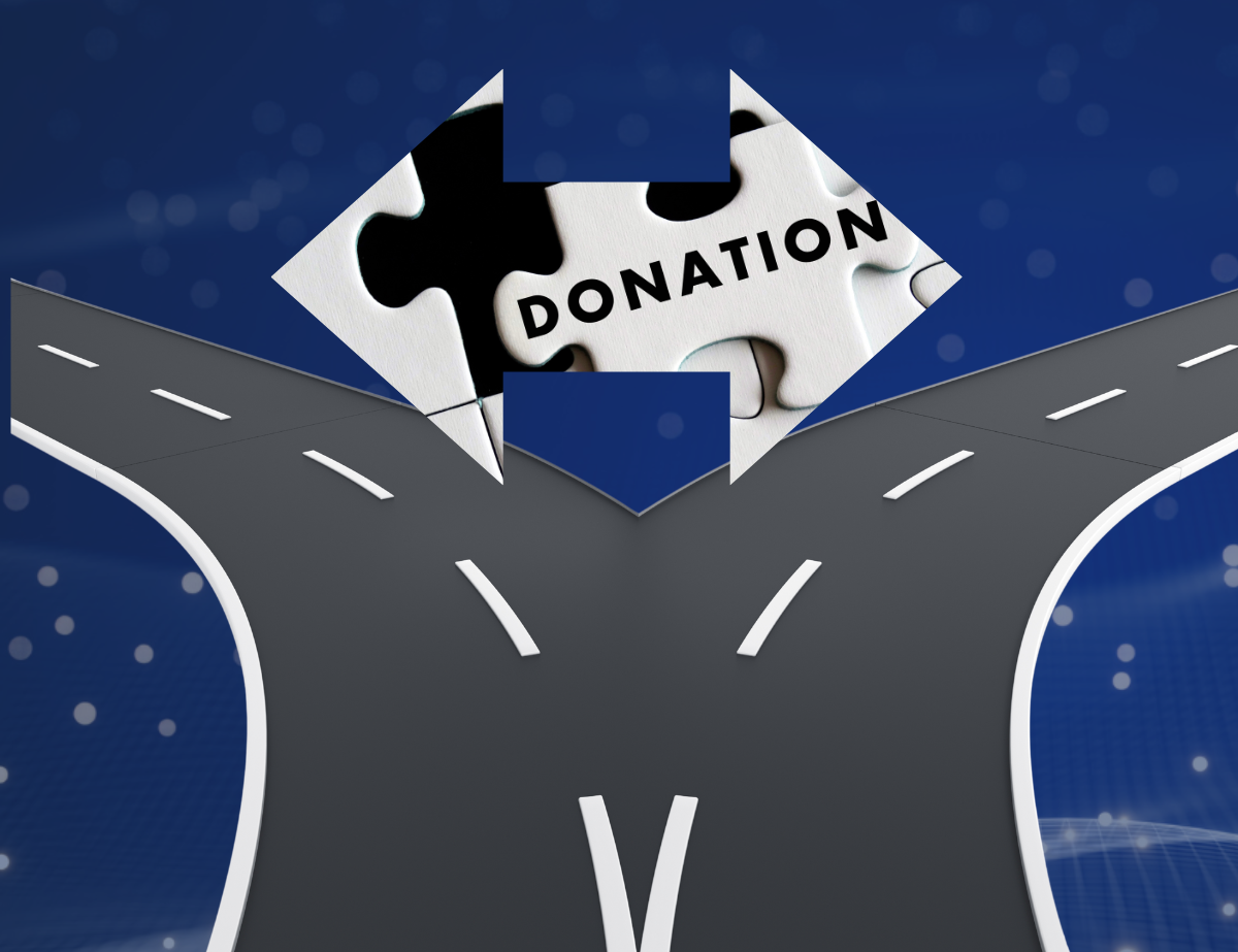 Text that reads Donation inside a double arrow on top of a street that splits left and right