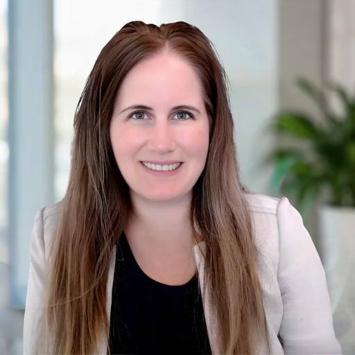 Woman with long brown hair smiling in front of a blue background with abstract dotted lines and circles. She is wearing a light-colored blazer over a dark top.