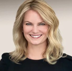 Woman with blonde hair wearing black top smiling