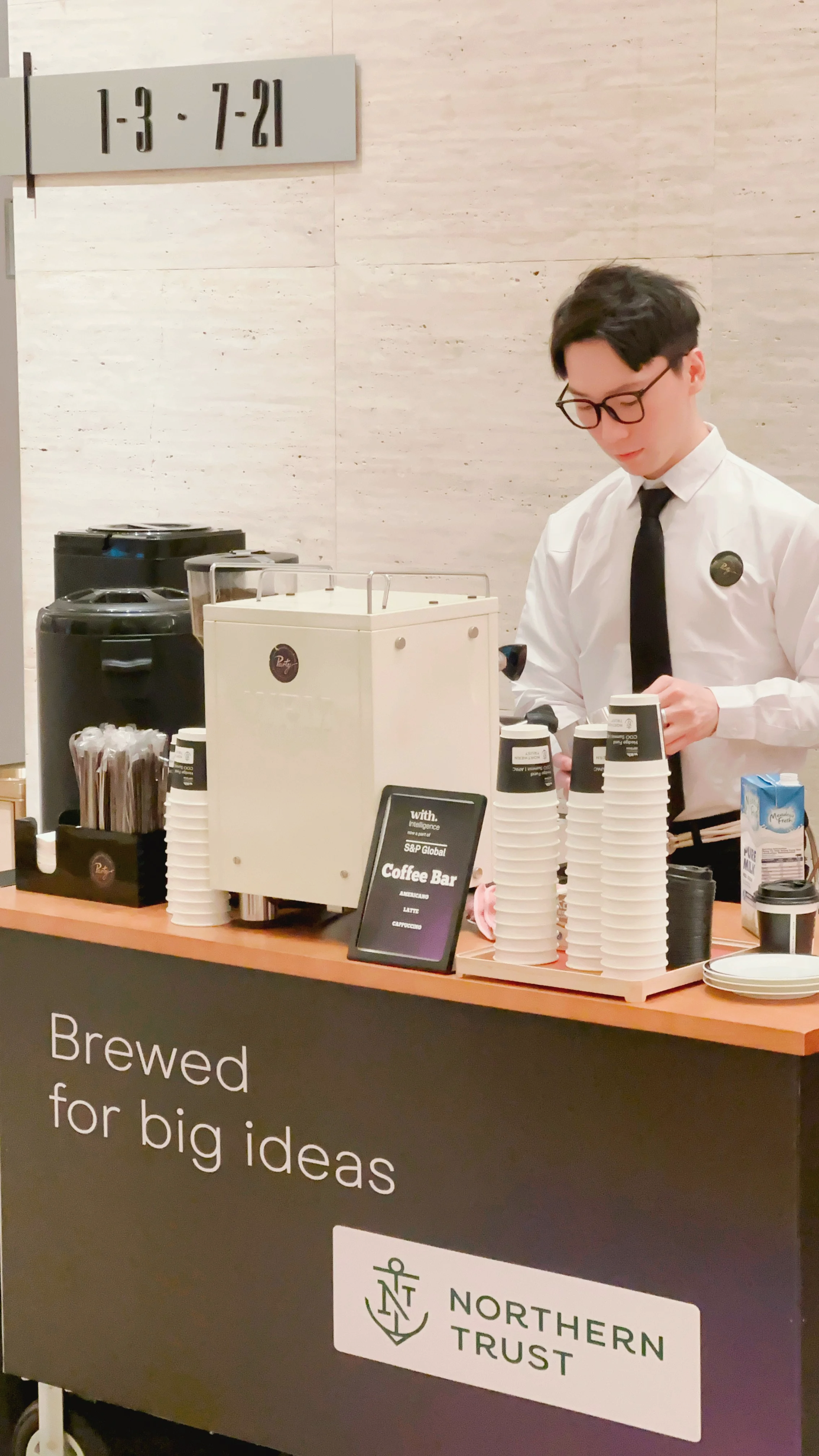 Barista serving speciality coffee at custom branded booth from HFM COO Summit APAC 2026 corporate event in Macau 