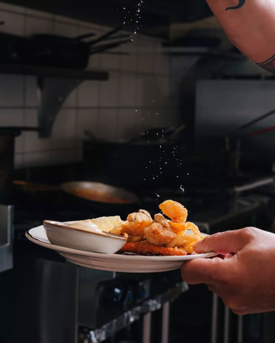 A little crunch, a touch of salt, and a bright squeeze of lemon, just the thing to start your night. Come join us at T&Aacute;VOLA and ease into something delicious. 🍽️💛