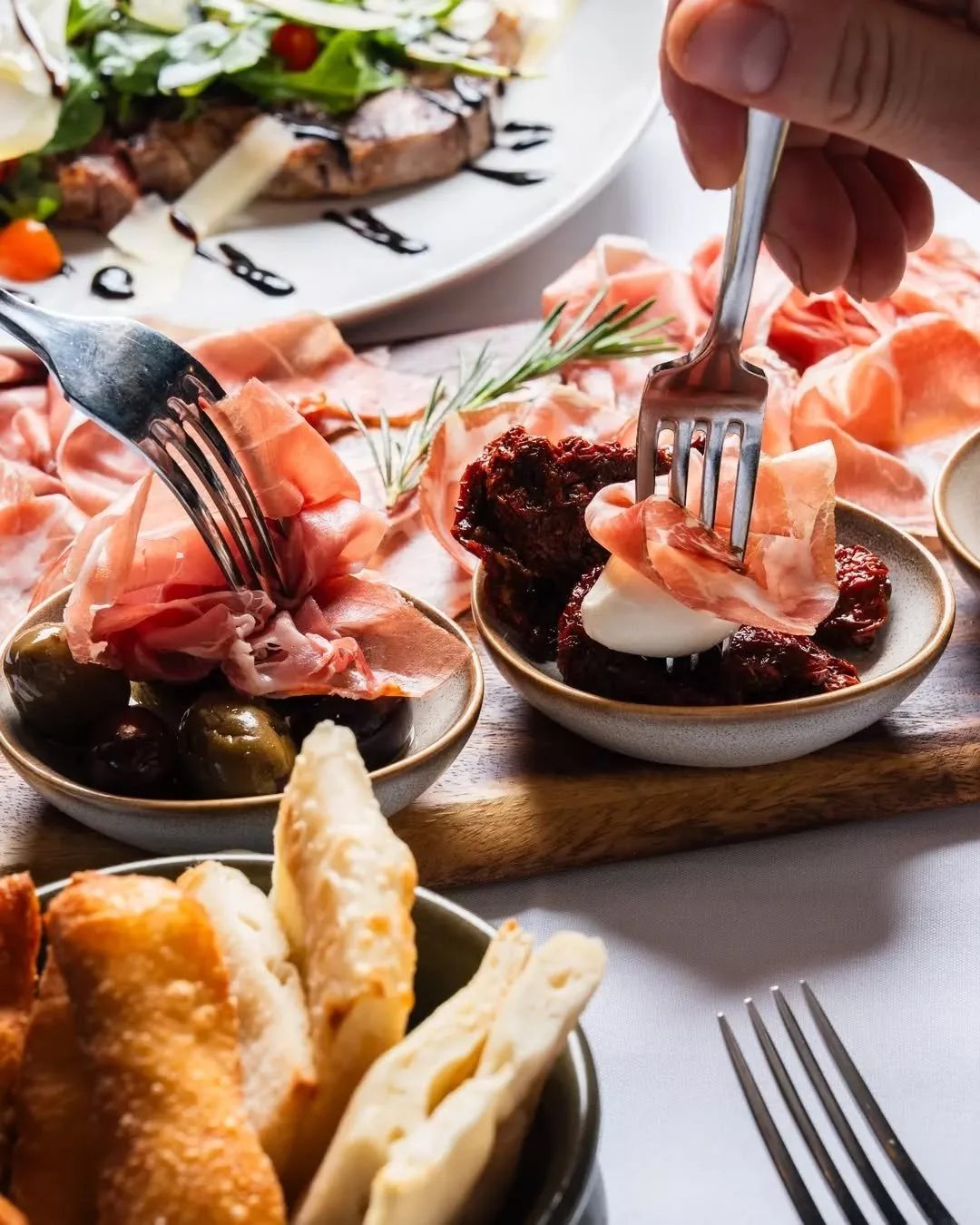 Meeting our Tagliere della T&aacute;vola, a beautiful spread of cured meats, Italian olives, Sottoli, cherry bocconcini, homemade focaccina and fried pizza. The kind of board you order and immediately wish you had ordered two 😉

Come in and start yo