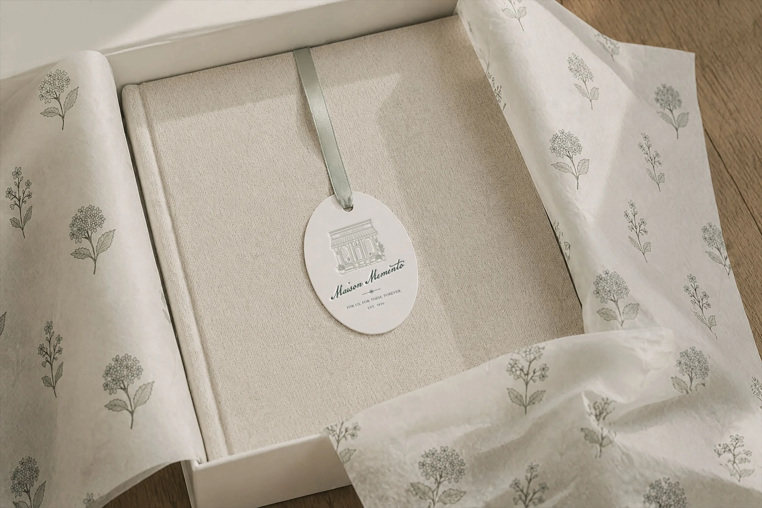 Maison Memento patterned tissue paper design featuring hand-drawn floral illustrations in soft sage green.