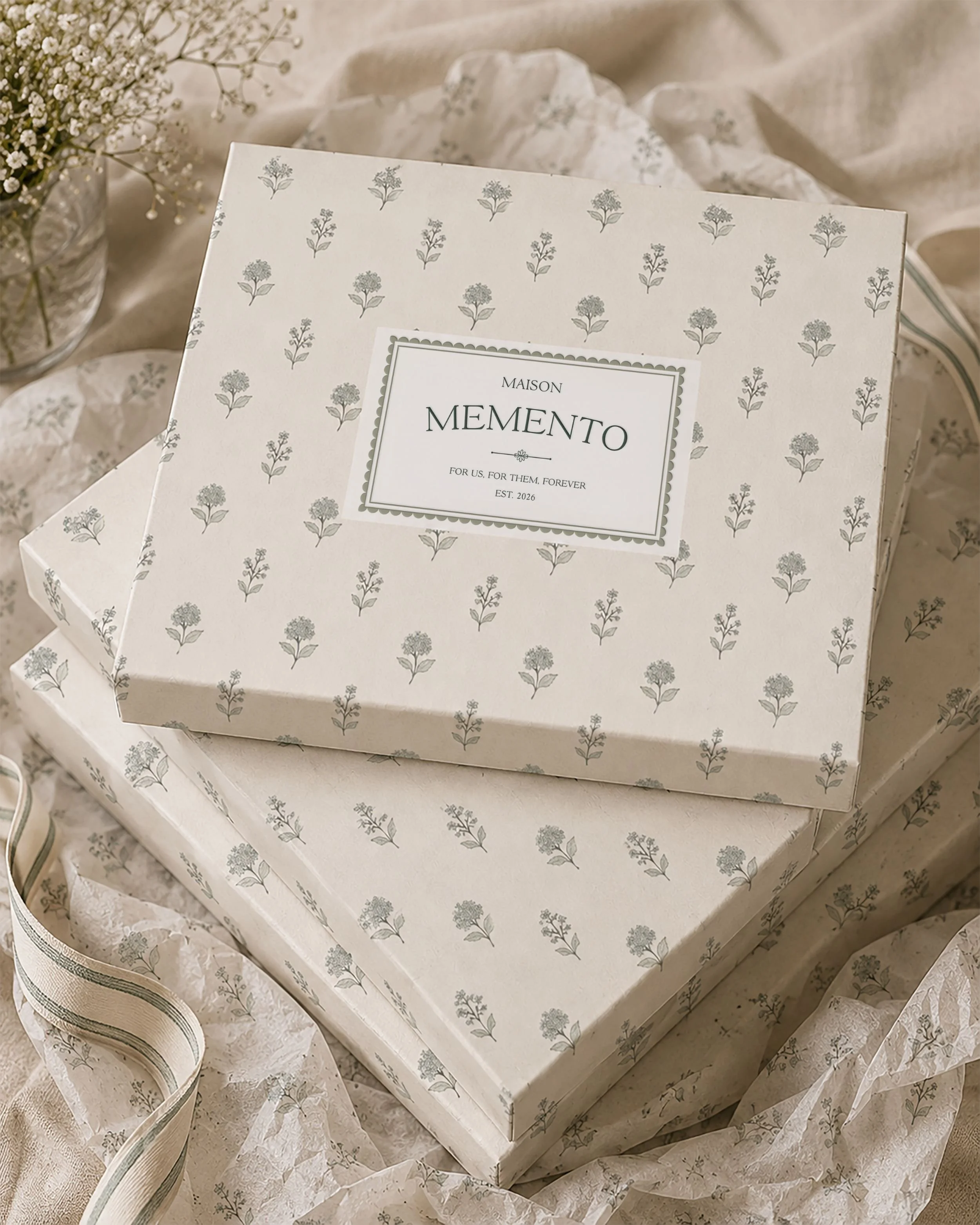 Maison Memento luxury packaging design with botanical floral pattern and custom brand identity.