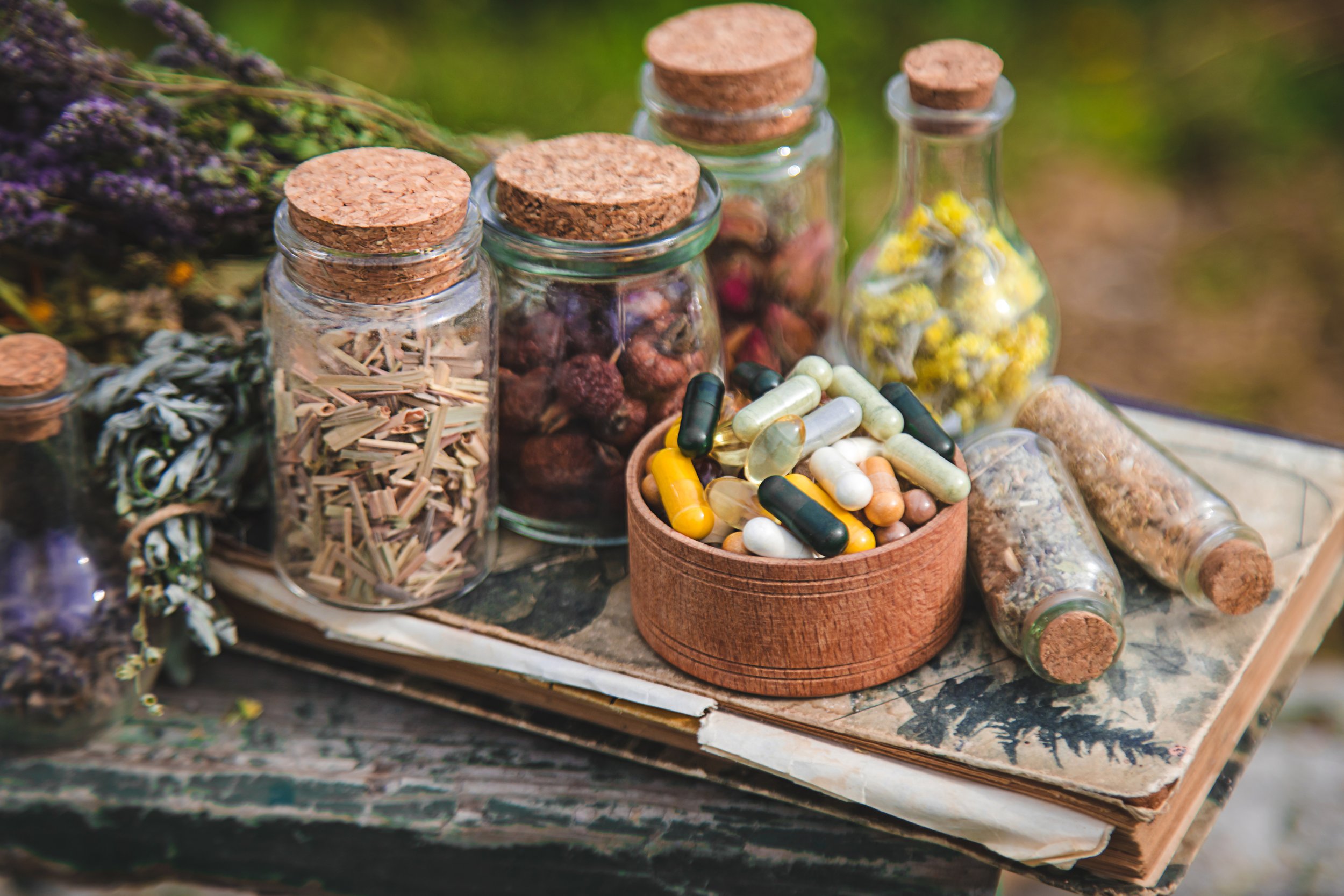 Chinese herbal prescriptions and herbal medicine in Singapore, showing traditional dried herbs and modern herbal capsules prepared for personalised TCM treatment