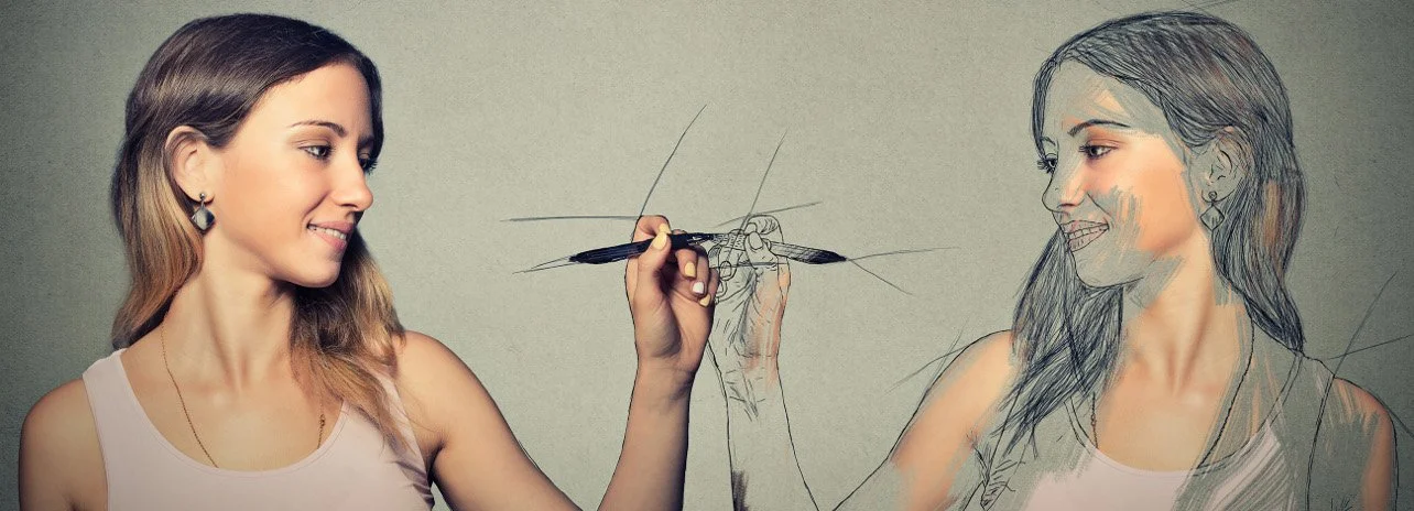 A woman in real life and a drawing of the same woman, facing each other and smiling. The woman is holding a pen, drawing the sketch of herself.