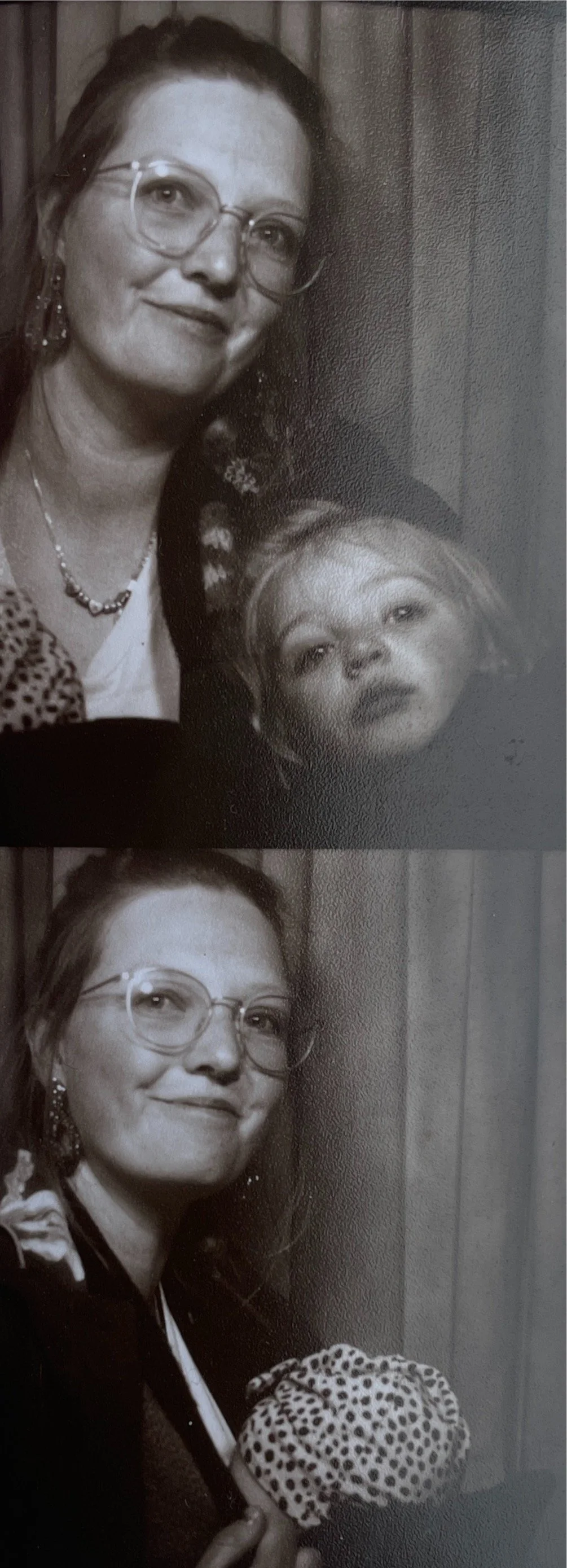 A black and white film strip of photographs. One where me, Jenn Davy-Day is smiling with my two year old daughter looks into the frame. And another where you can see my youngest baby daughter in a carrier with a baby turban on her head