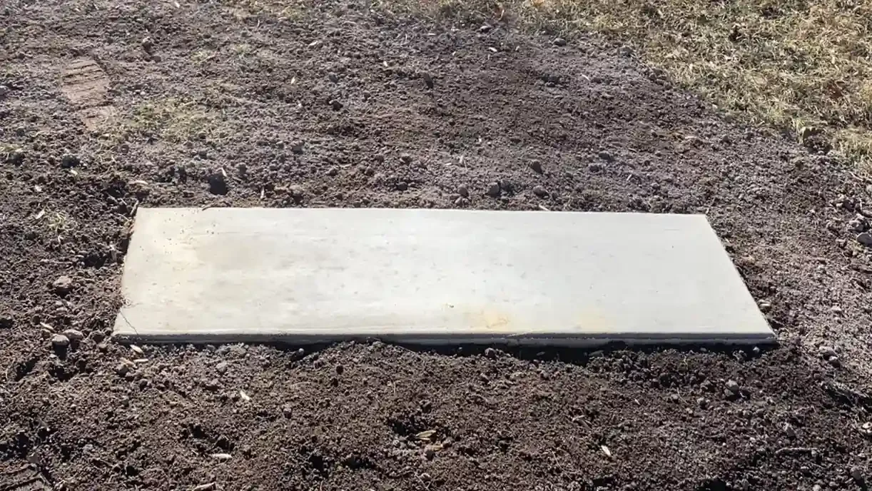 Concrete foundation pad for a future headstone