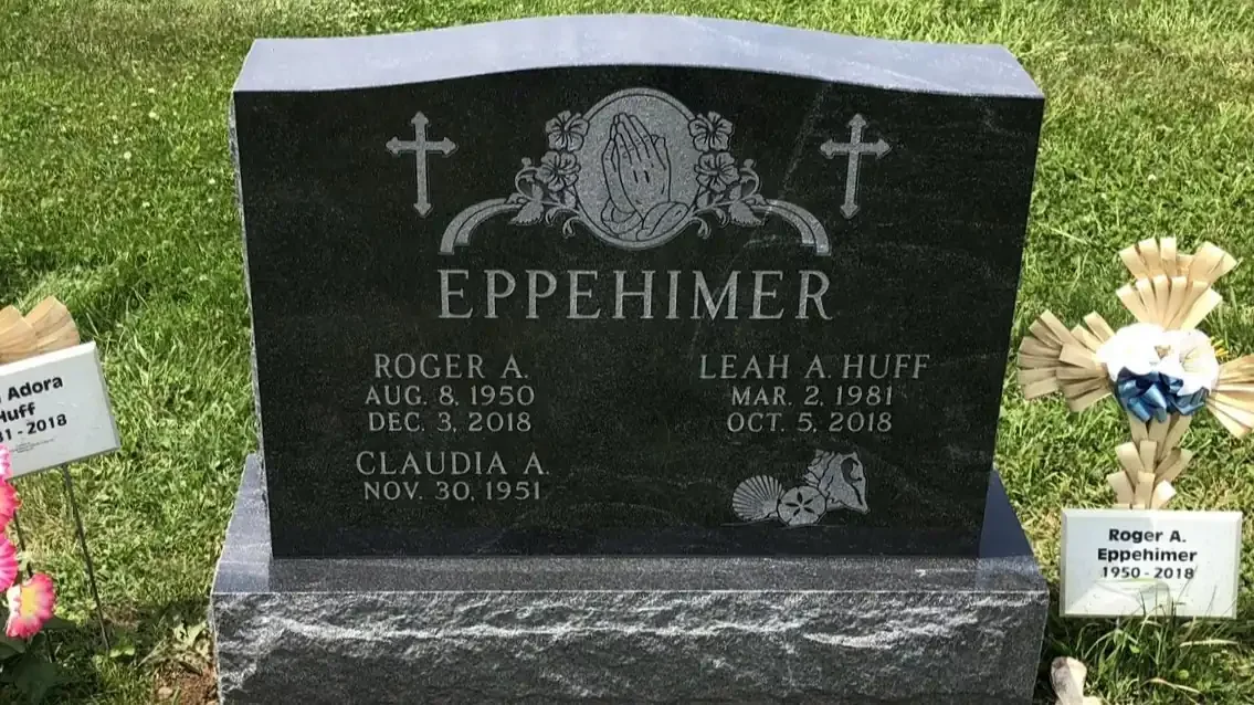 Black upright headstone with design