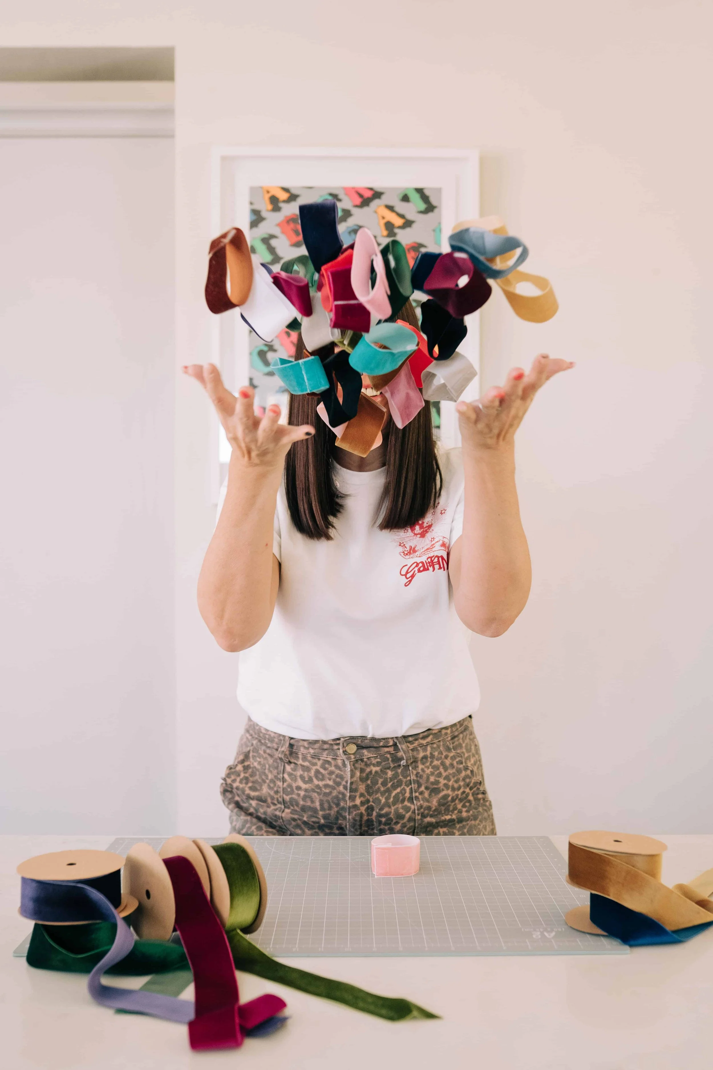Mother of pearl handmade throwing her velcro velvet paper chain loops in the air